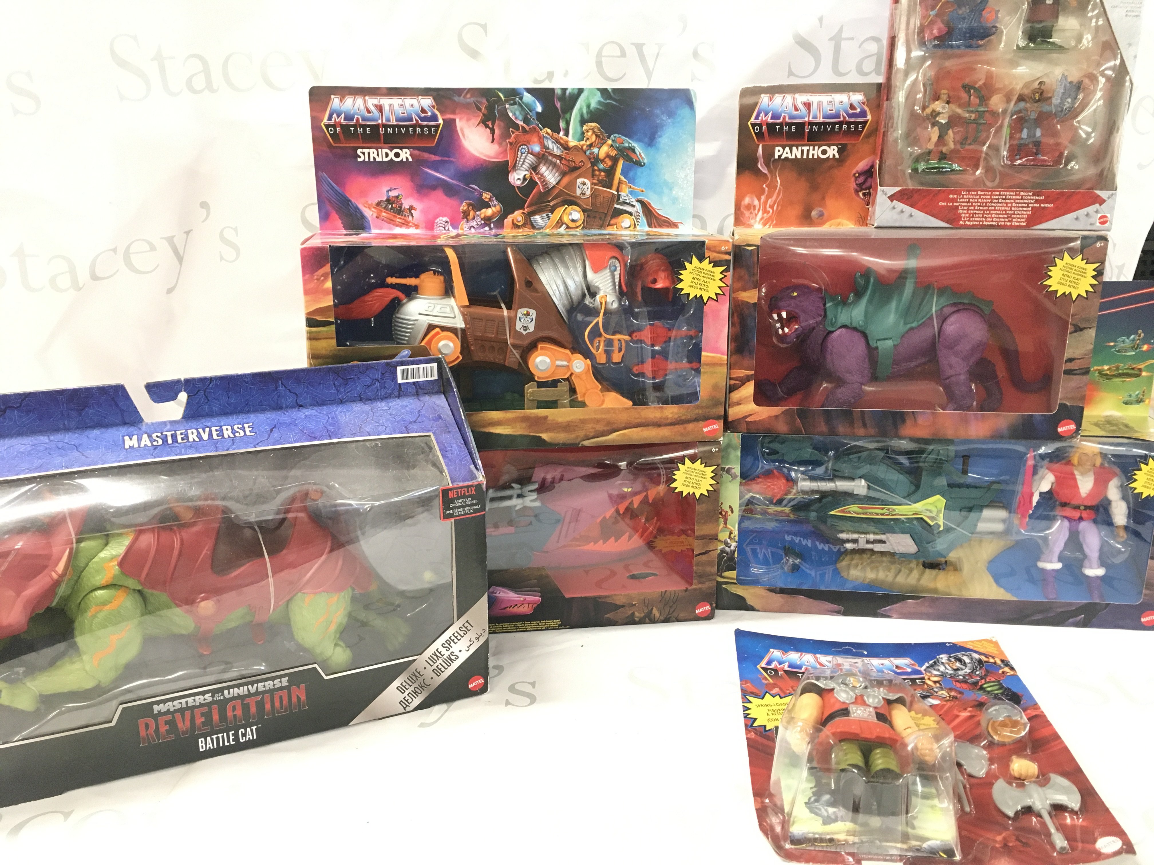 A Collection of Boxed modern Master Of The Universe Figures And Ships Including Battle Cat. Stridor. Panther. Ram Man Etc.