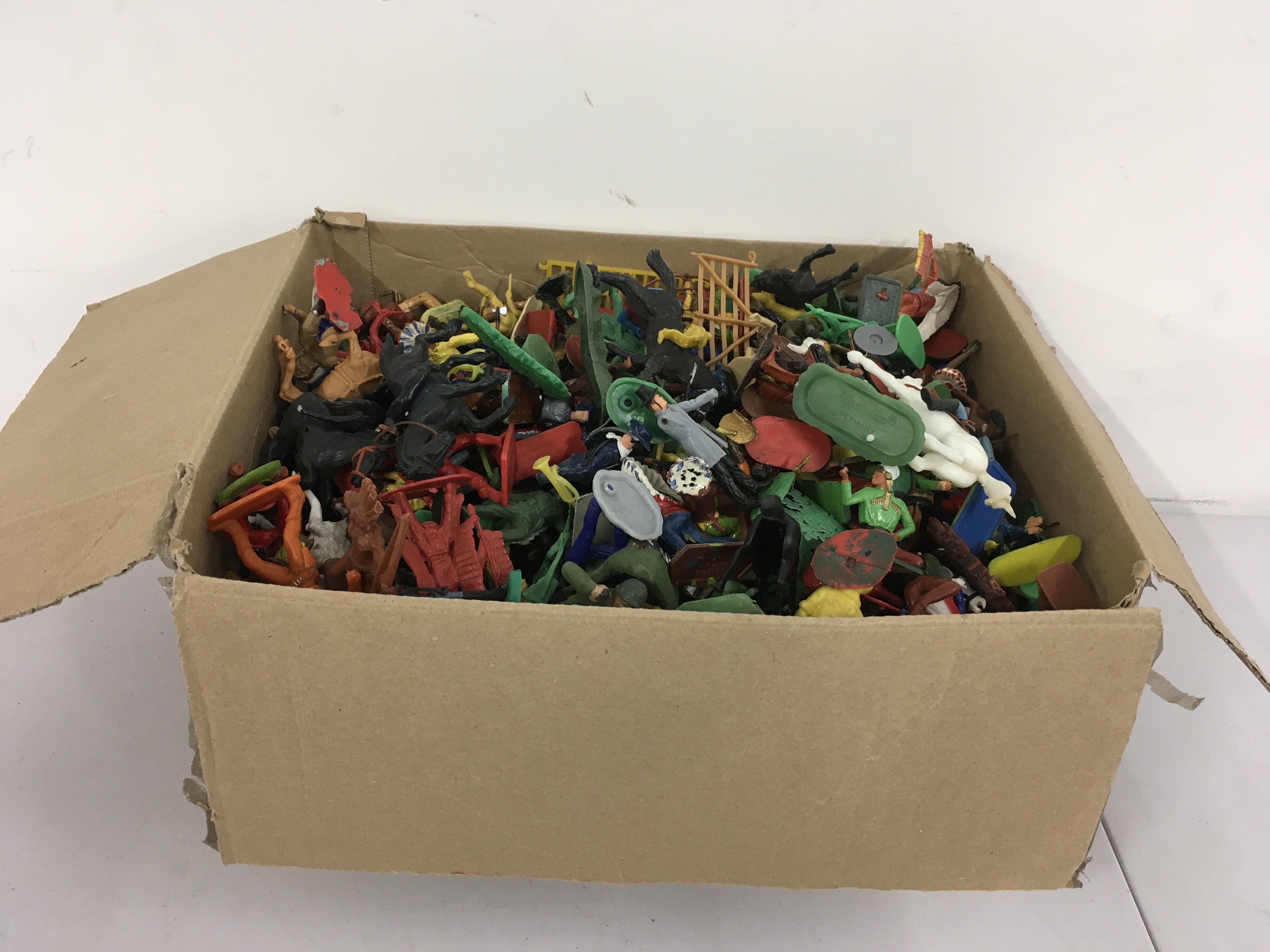 A box of Plastic figures by Britain..Crescent..Kellogg&rsquo;s..Elaston..Starlux etc.