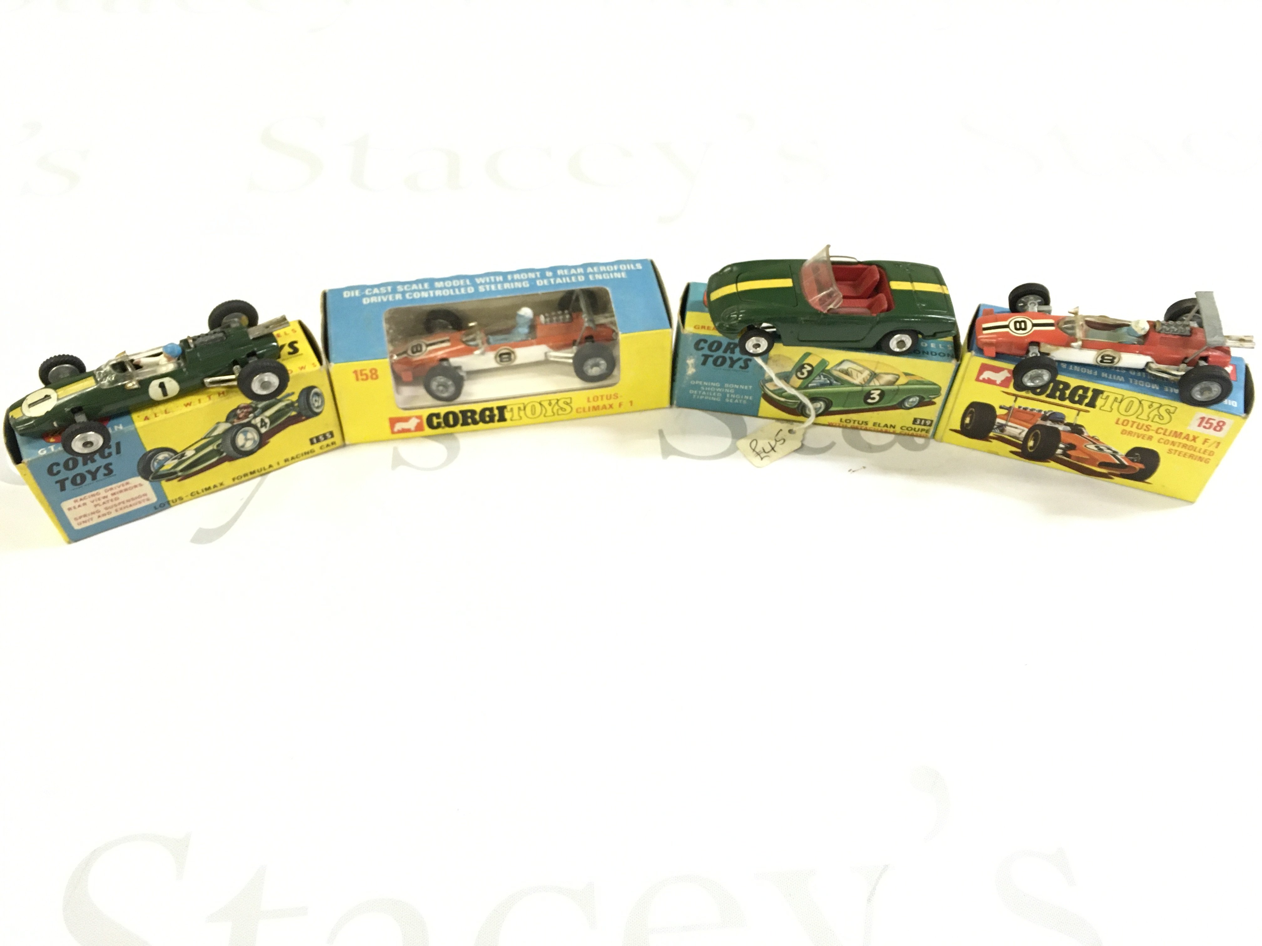4 X Boxed Corgi Vehicles. A Lotus-Climax Formula 1 Racing Car #155. A lotus Climax F1 #158. A Lotus Elan Coupe #319 and A Lotus Climax #158.