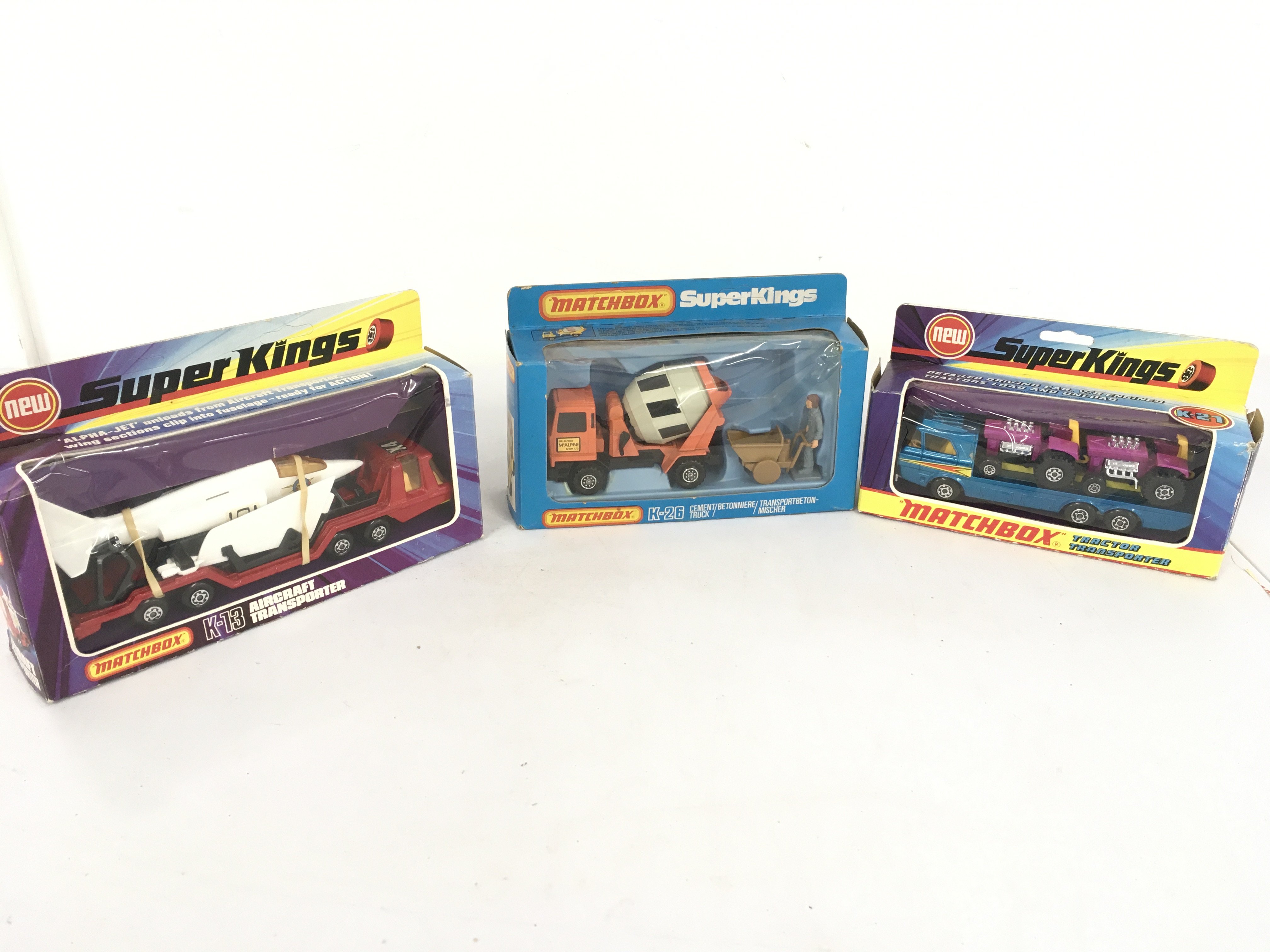 3 boxed Matchbox Superkings no. K13 aircraft transporter..K21 tractor transporter..K26 cement truck. No reserve