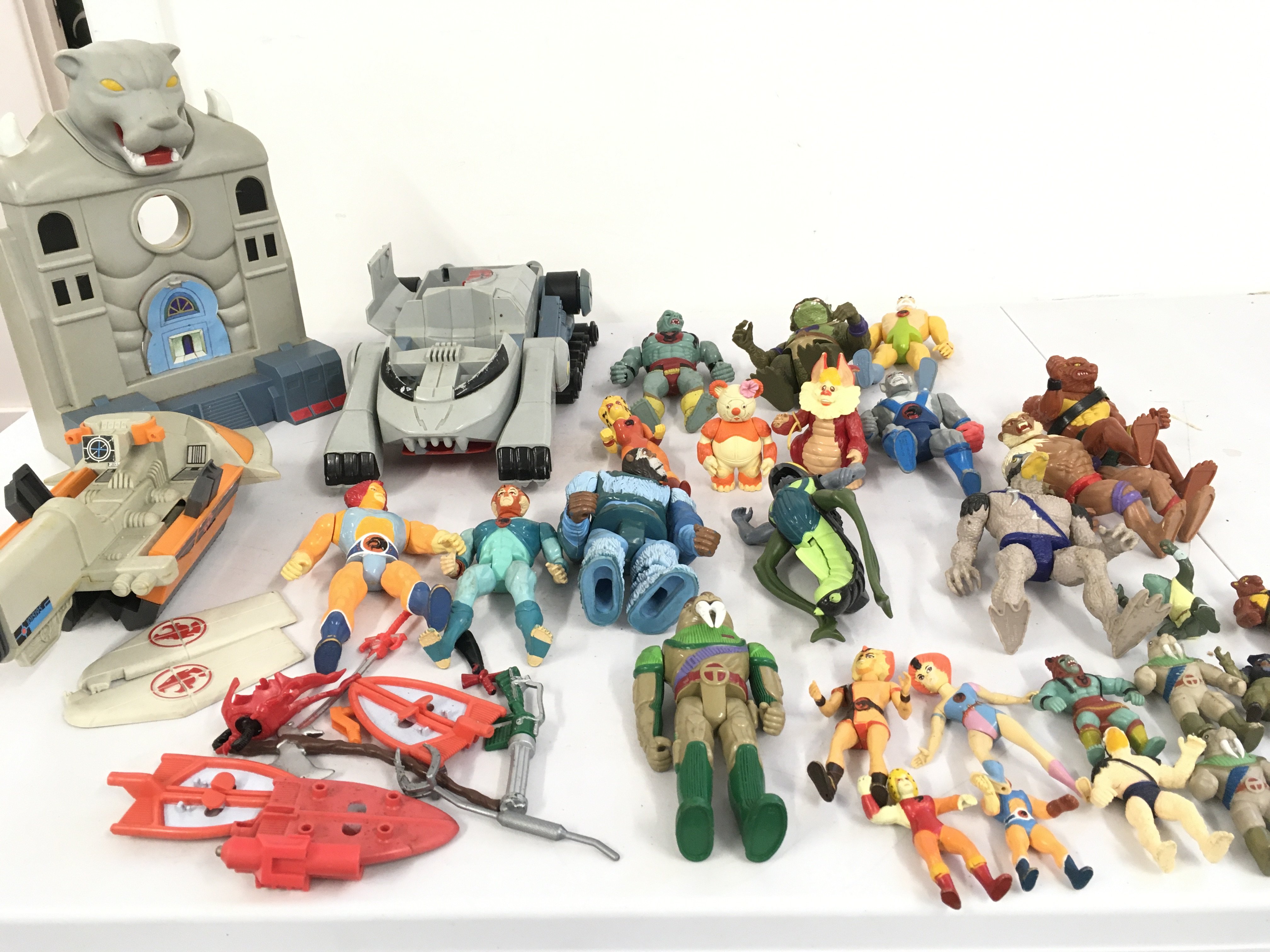 A collection of Thundercats action figures including a rare Stinger ..vehicles ..building and accessories. Also includes a collection of Thundercats mini figures. No reserve