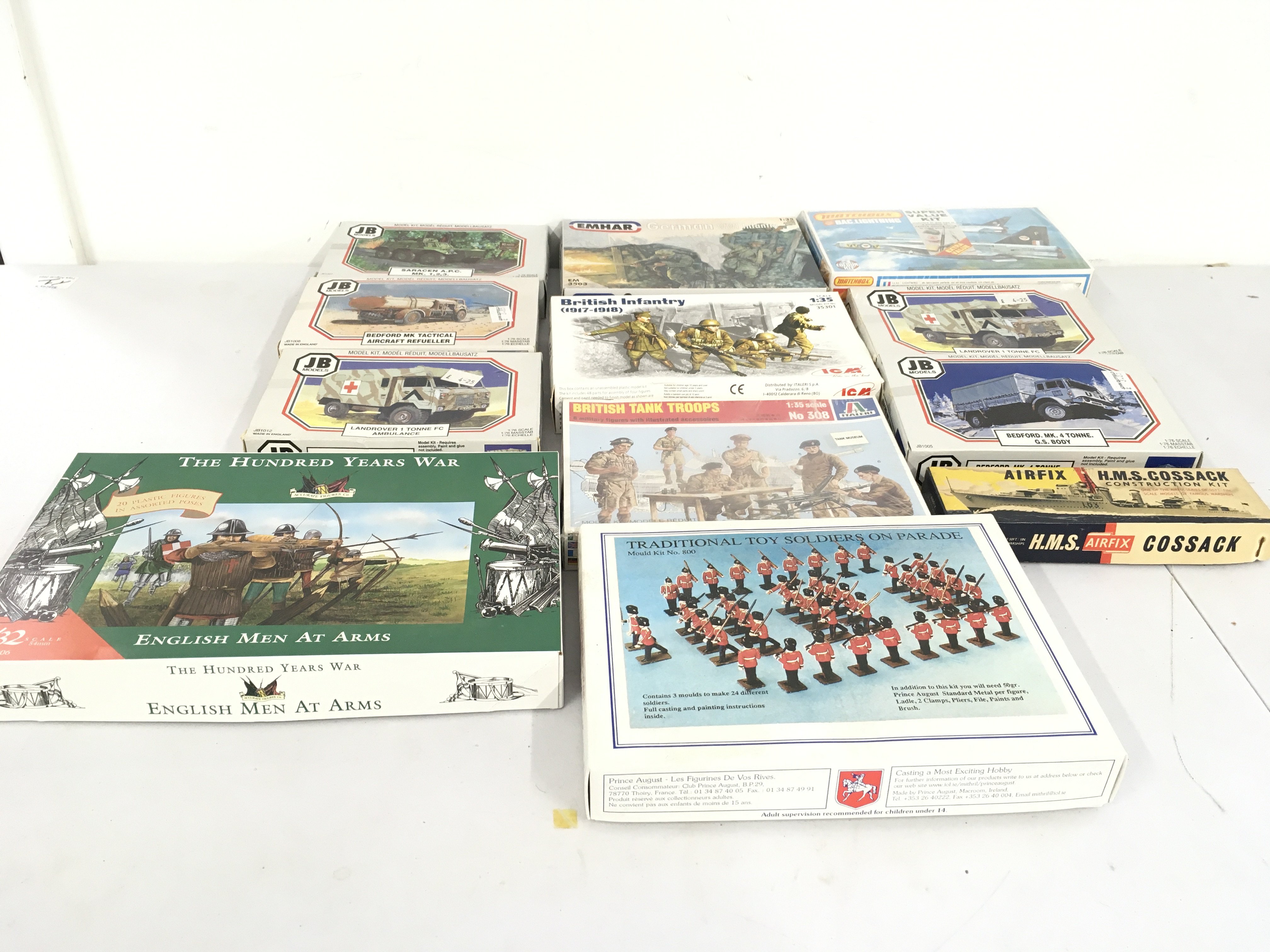 An assorted collection of military modelling kits featuring soldiers and vehicles by JB..Matchbox..Italeri etc. no reserve