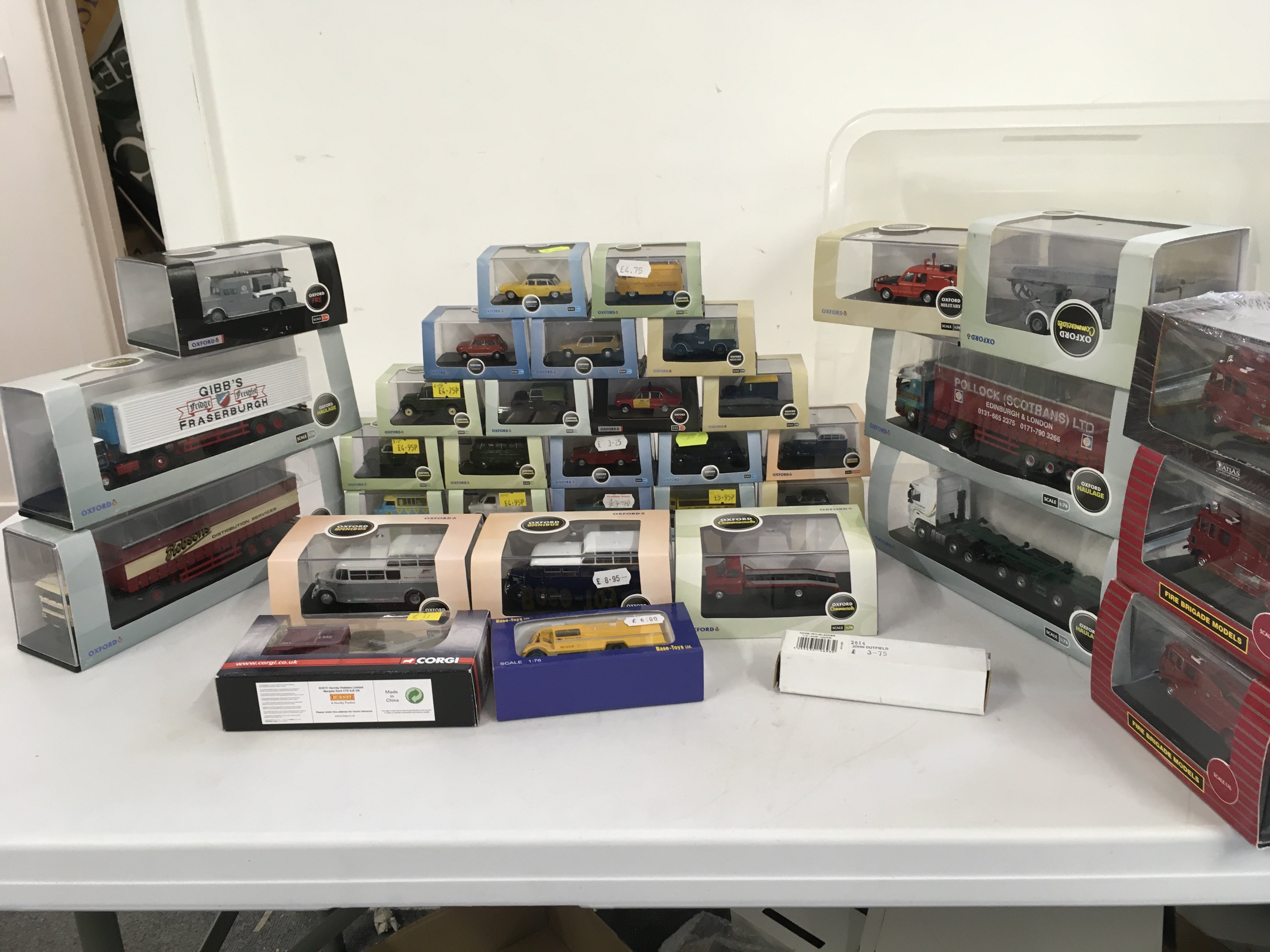 A collection of Oxford diecast model vehicles in display boxes featuring fire engines..buses..cars etc. no reserve