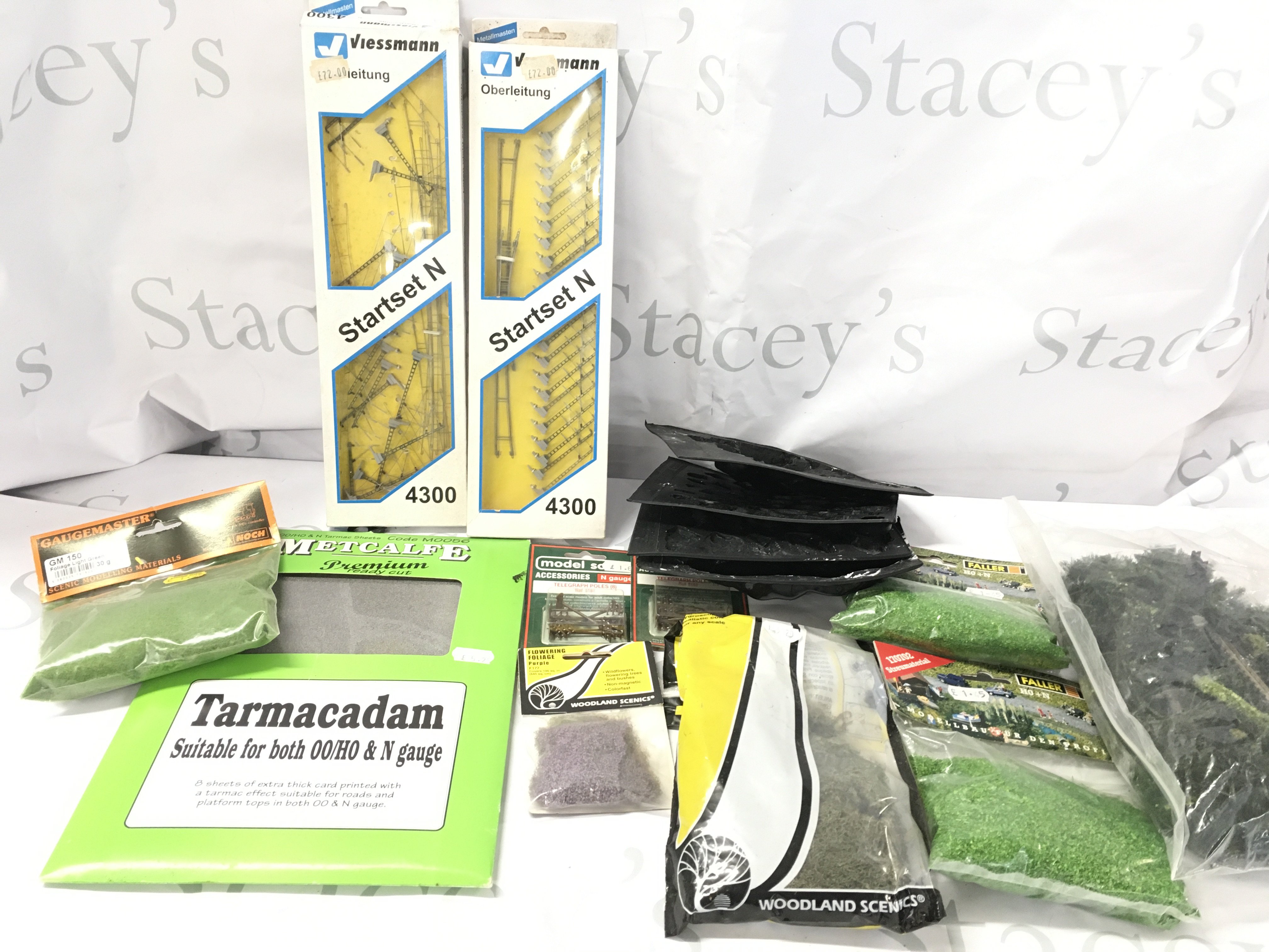 A Box Containing N Gauge Accessories. Includes Track. A Control Unit. Relays Etc.