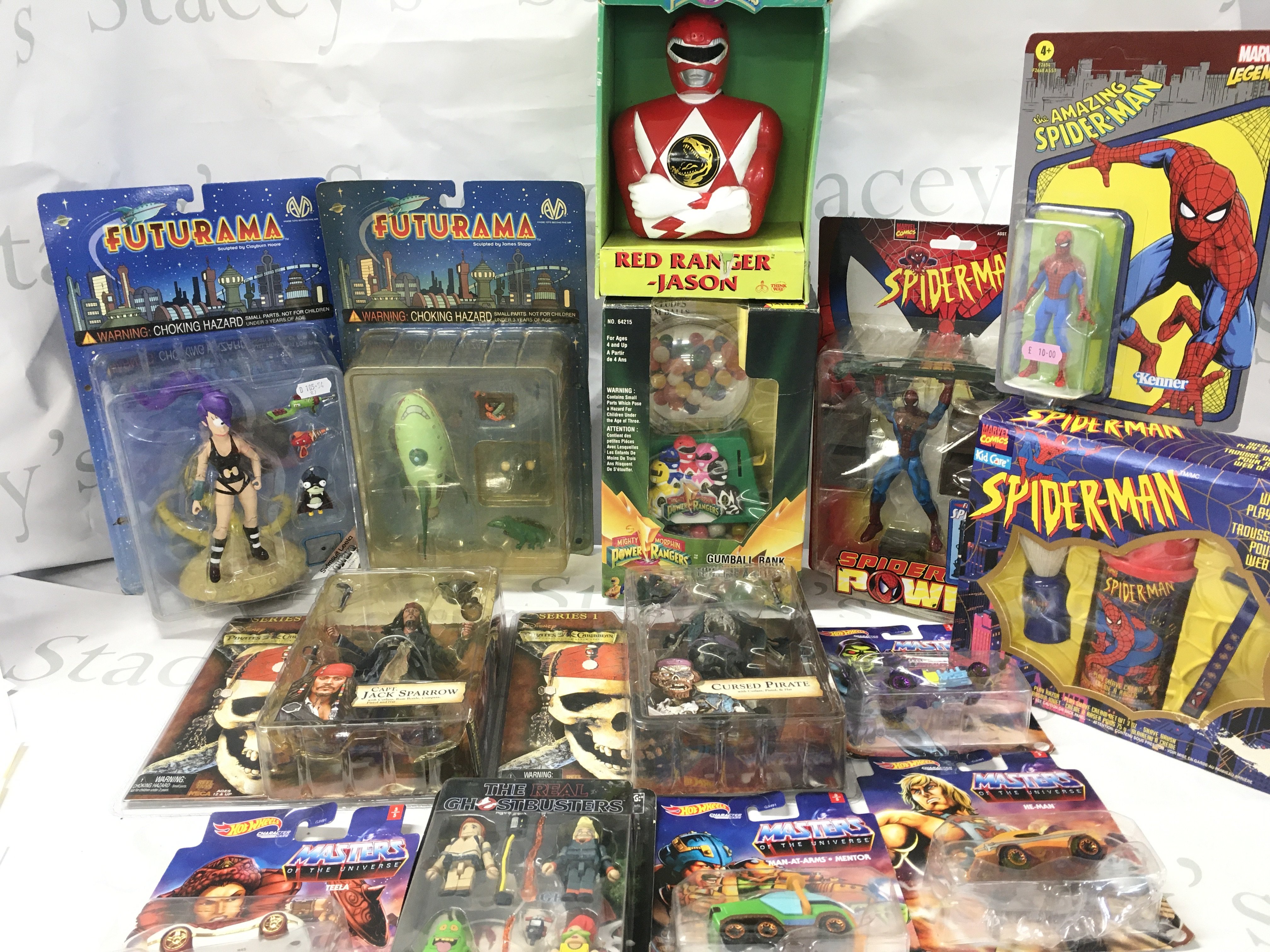 A Collection of Boxed Toys Including Futurama. pirates Of The Caribbean. Power Rangers. Spider-Man. Masters Of The Universe And Ghostbusters.