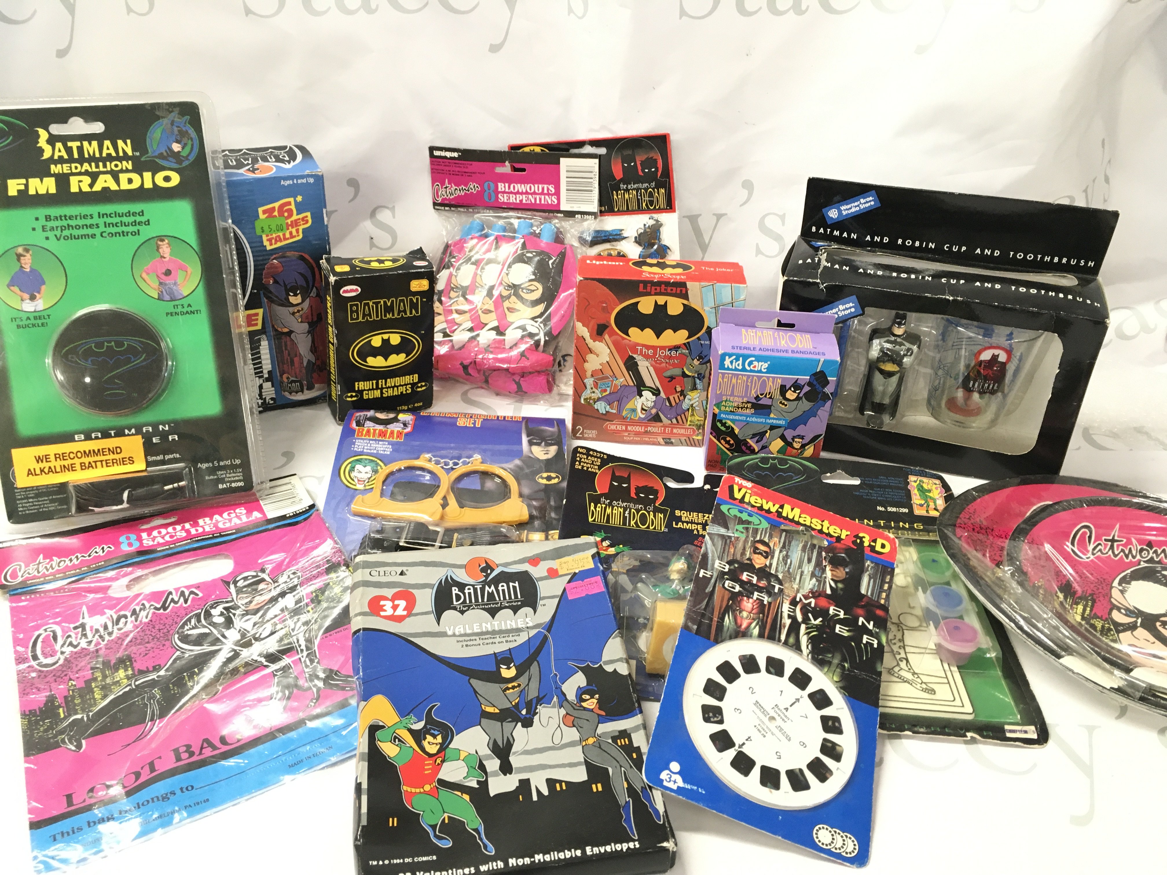 A Box Containing Various Batman Items including Toys. A Veiw-Master Reel and Other Oddments.