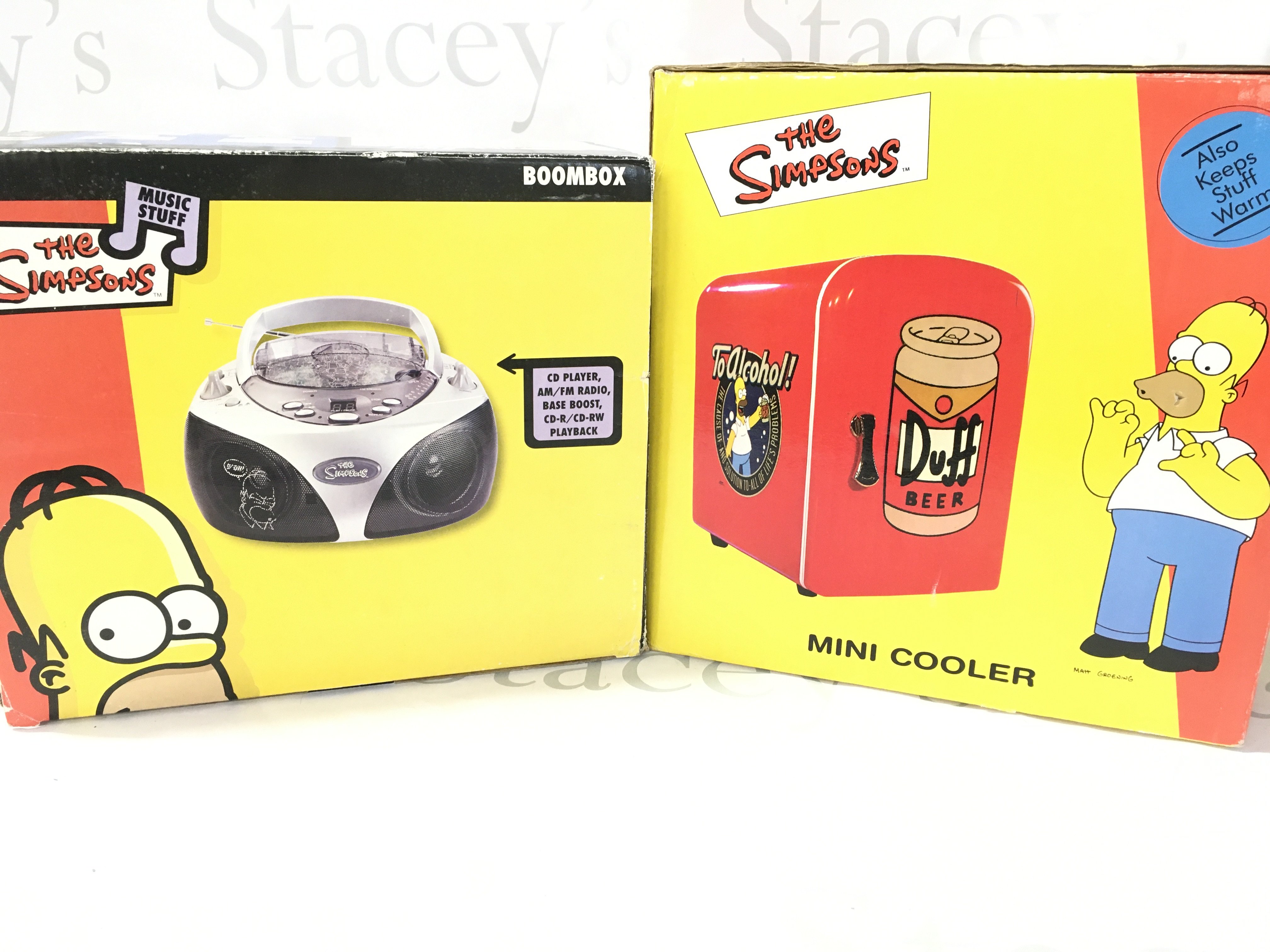 A Simpsons Boxed CD Player Mini Cooler (Missing Lead). And A LED Desk Fan.(3).