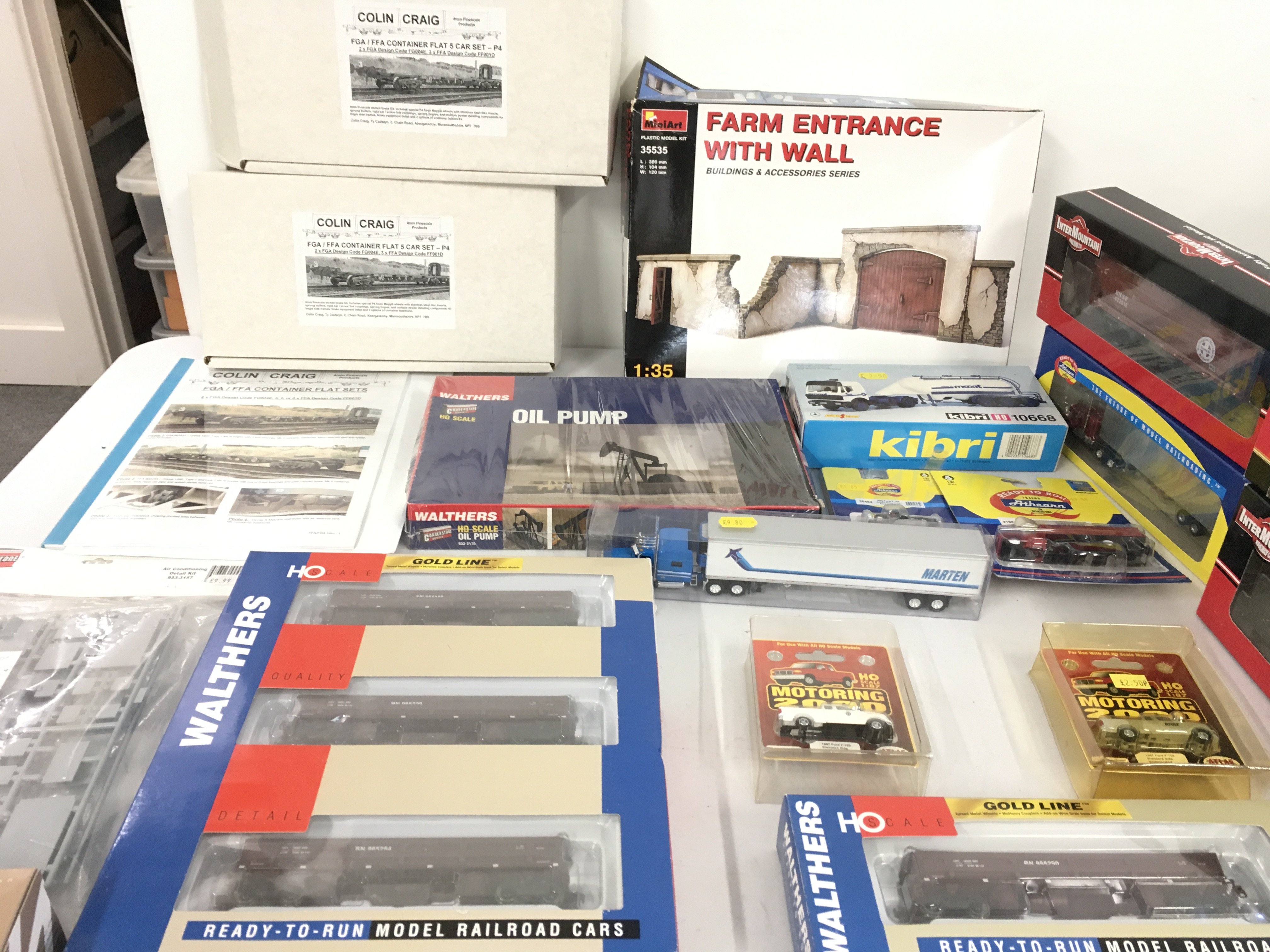 A Collection of HO scale model including railway Wagons and building plus road vehicles. No reserve.