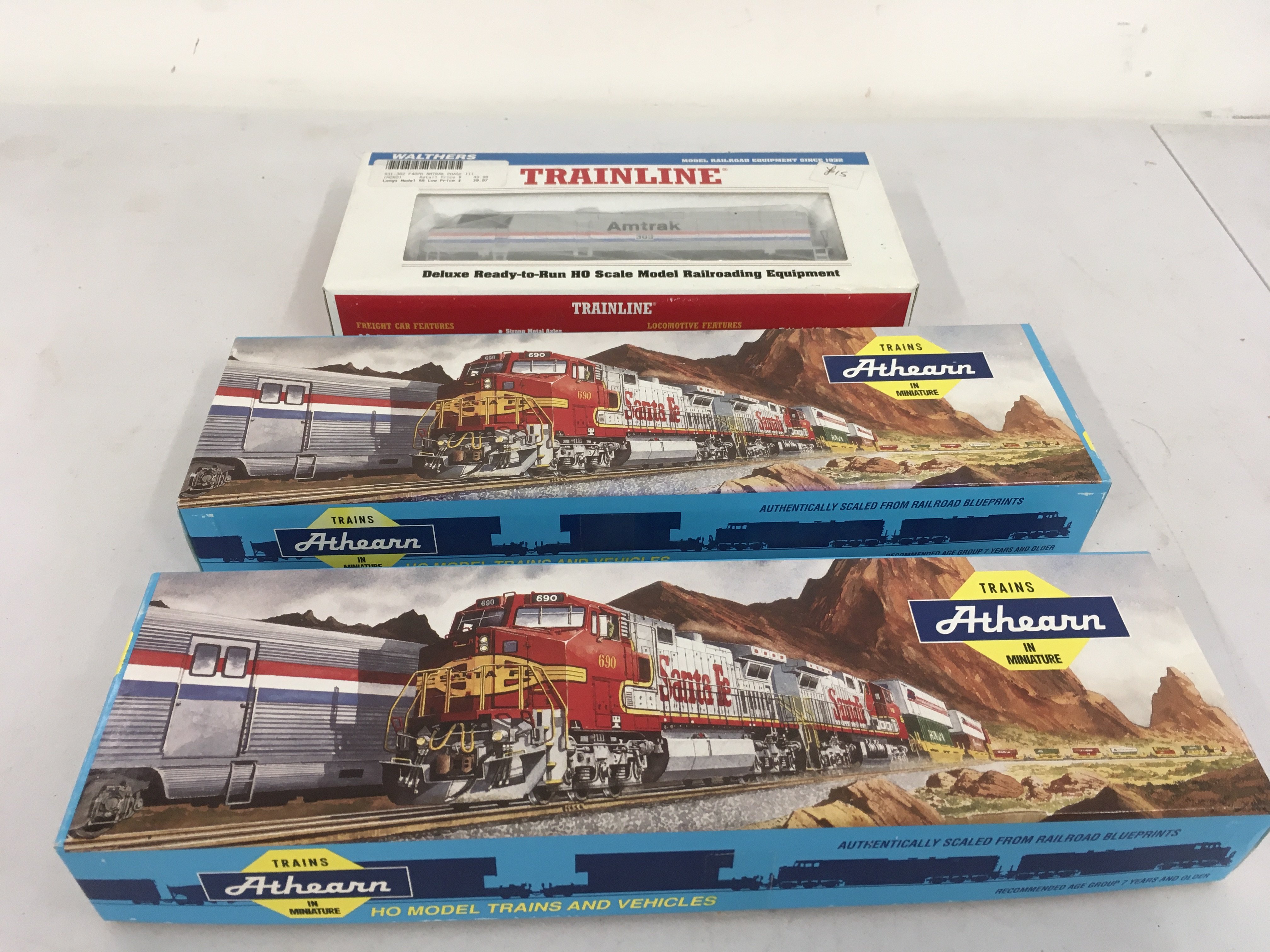 3x boxed HO gauge model railway locomotives includes Walthers EMD F40PH and Athearn 4802 .. 4801. No reserve