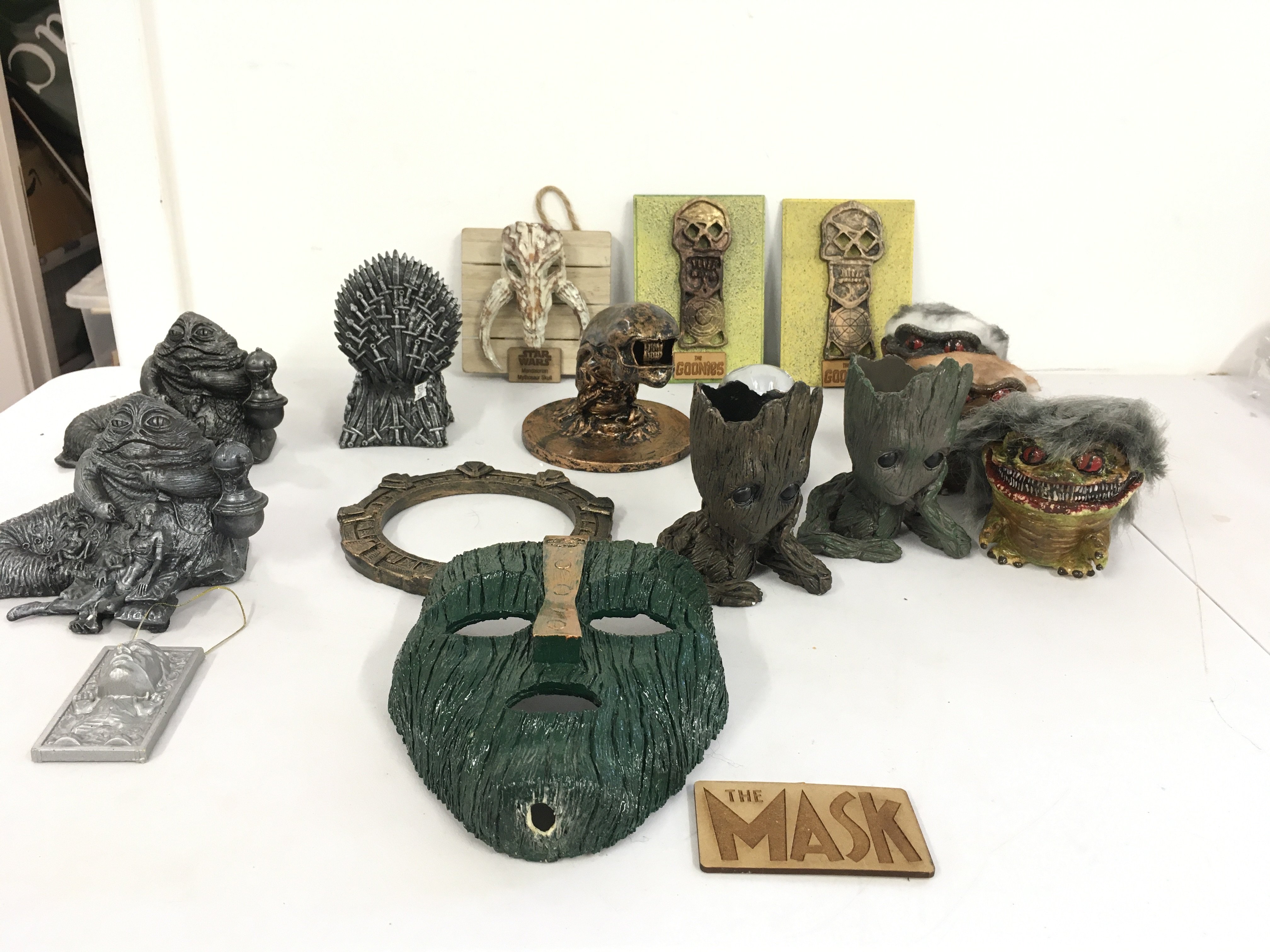 A collection of resin cast figures themed of films such as Star Wars..The Mask..Critters..Terminator plus others. No reserve