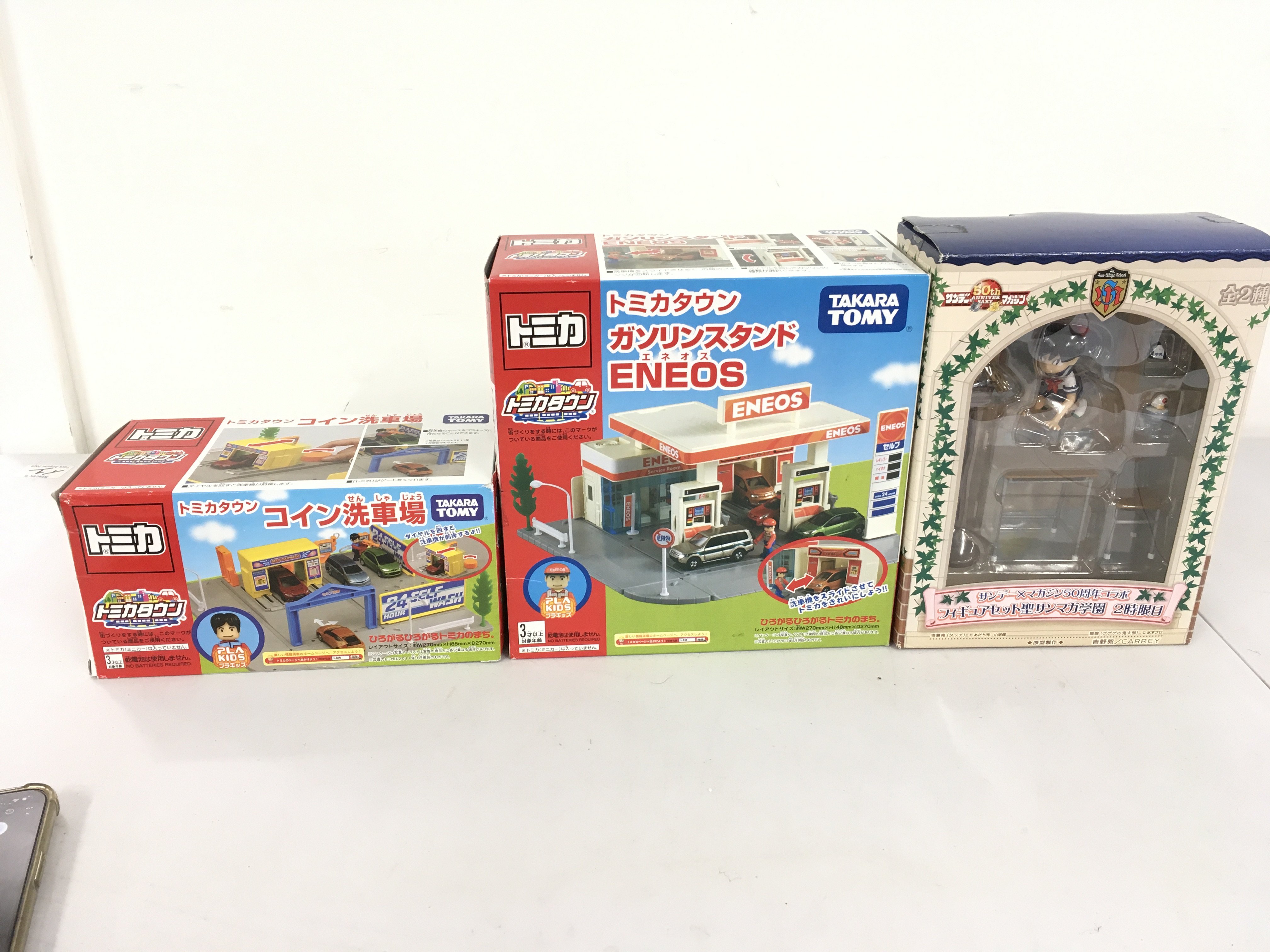 3 boxed toys 2 x Takara Tomy discontinued enos service station plus town coin car wash. and Sunday x magazine 50th anniversary figure set saint sanmaga 2nd period.