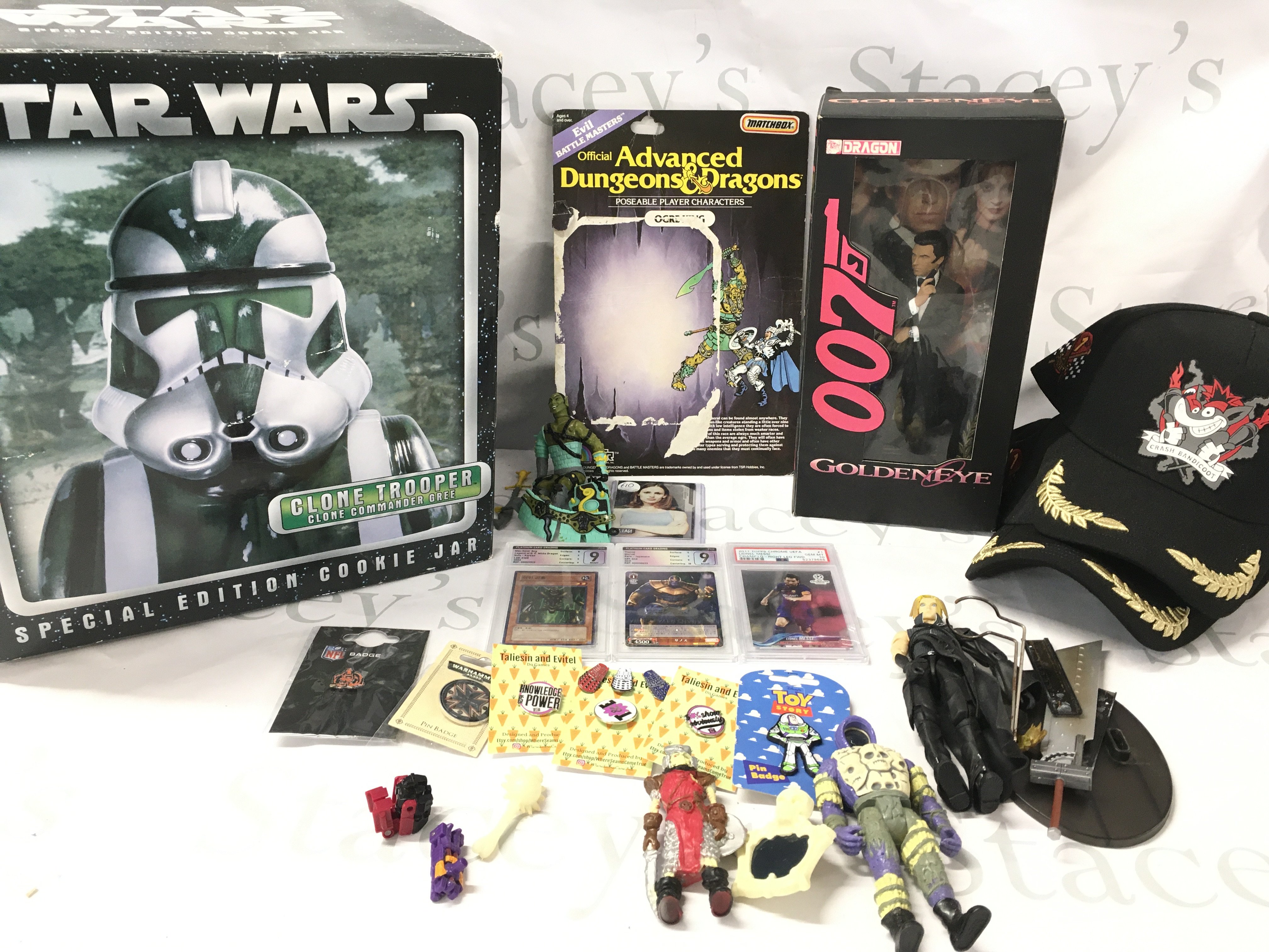 A Boxed Star Wars Clone Trooper Cookie Jar. Crash Bandicot Promo Caps. Graded Trading Cards. Pin Badges And Figures.
