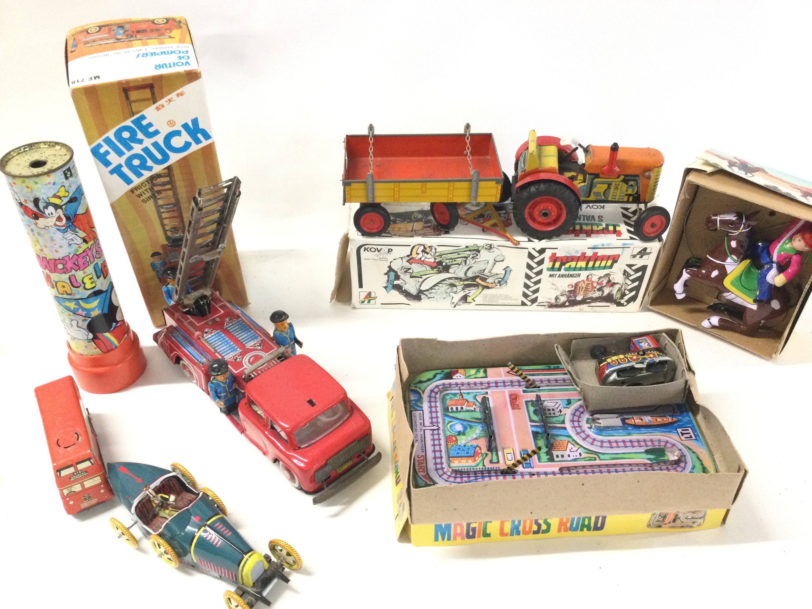 A Collection of Various Boxed And Loose Tinplate Toys. And A Vintage Cowboy Toy Watch.