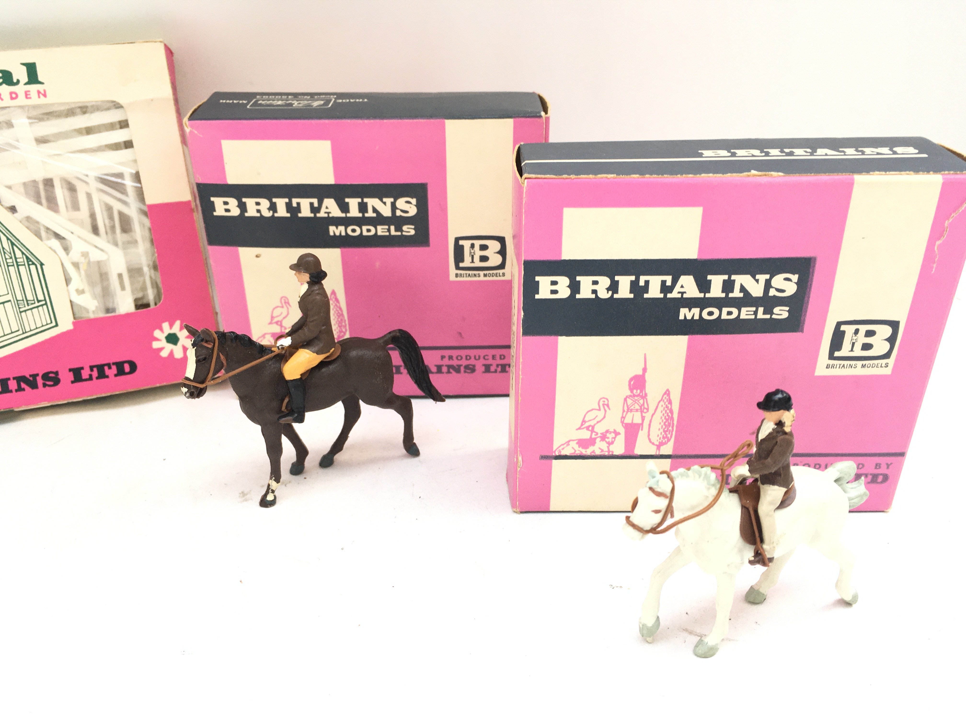 A Collection of 5 Boxed Britains. 4 Horse Riders And A Miniature Garden.