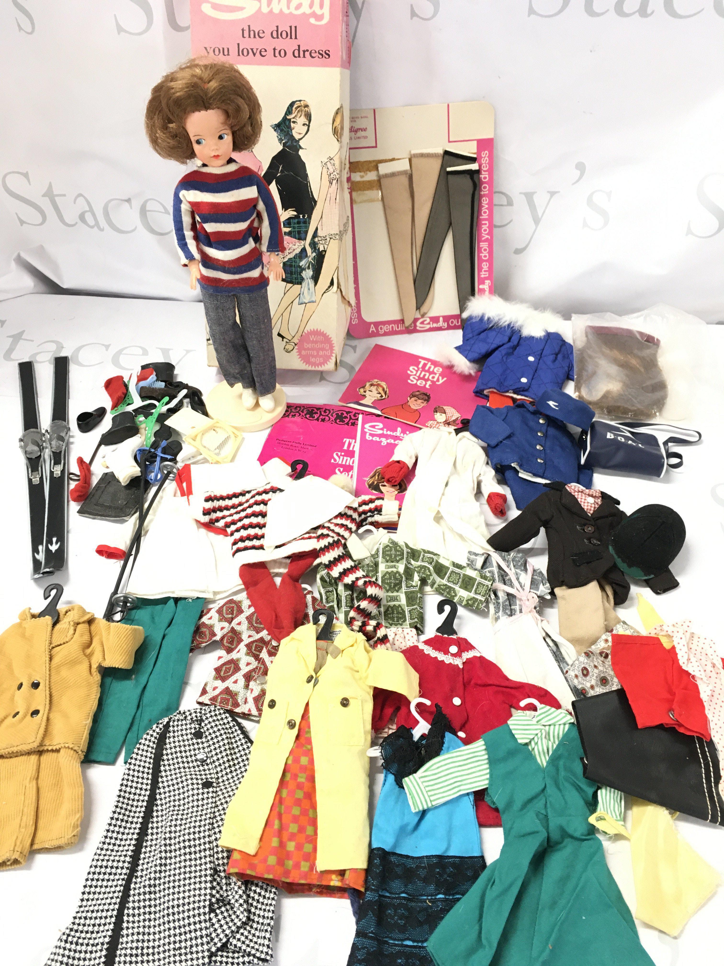 A Boxed Vintage Pedigree Sindy With A Collection of Cloths And Accessories. Sindy Arms And Legs do Not Bend.