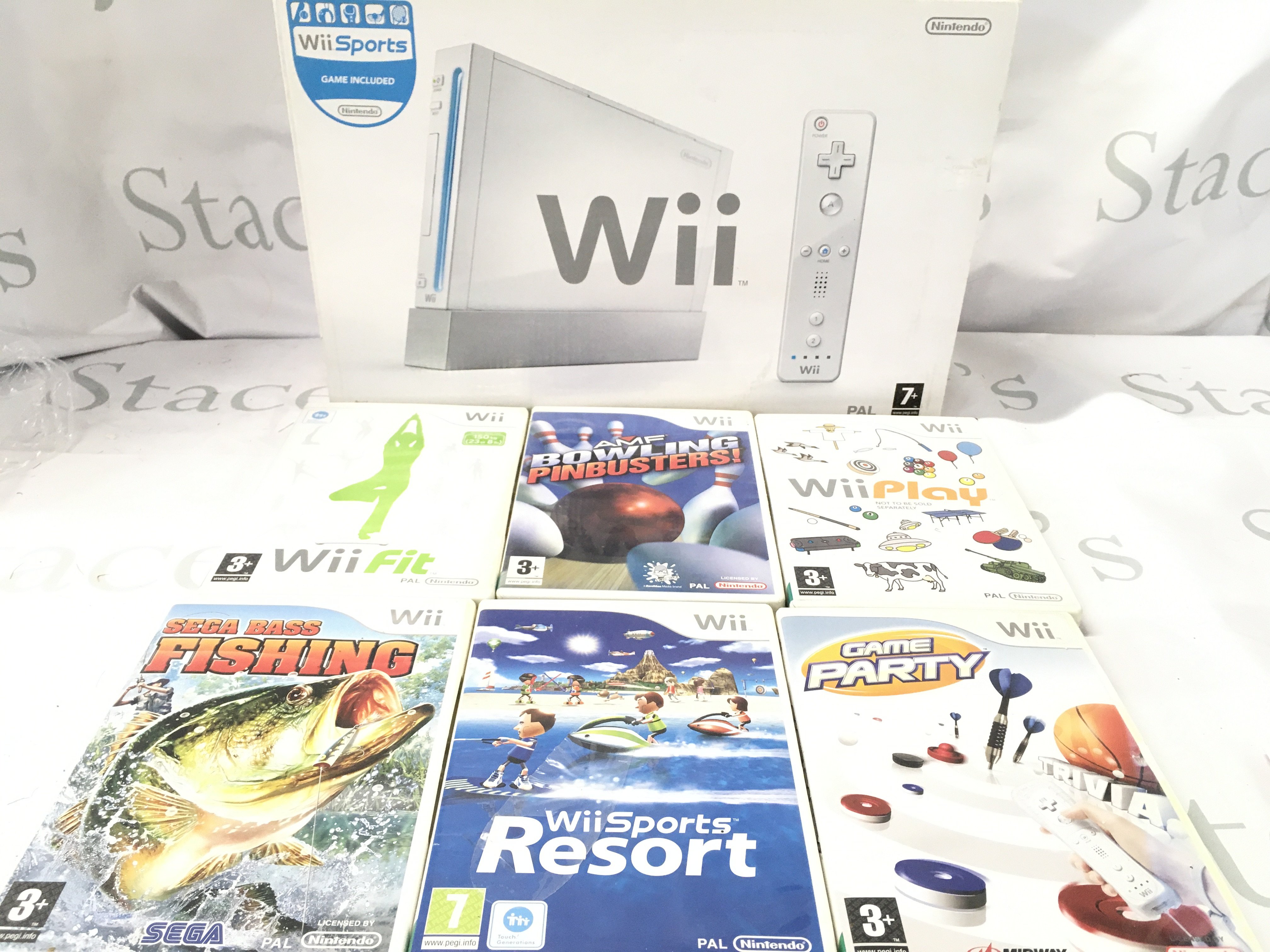 A Boxed Nintendo WII with Games.No Reserve.
