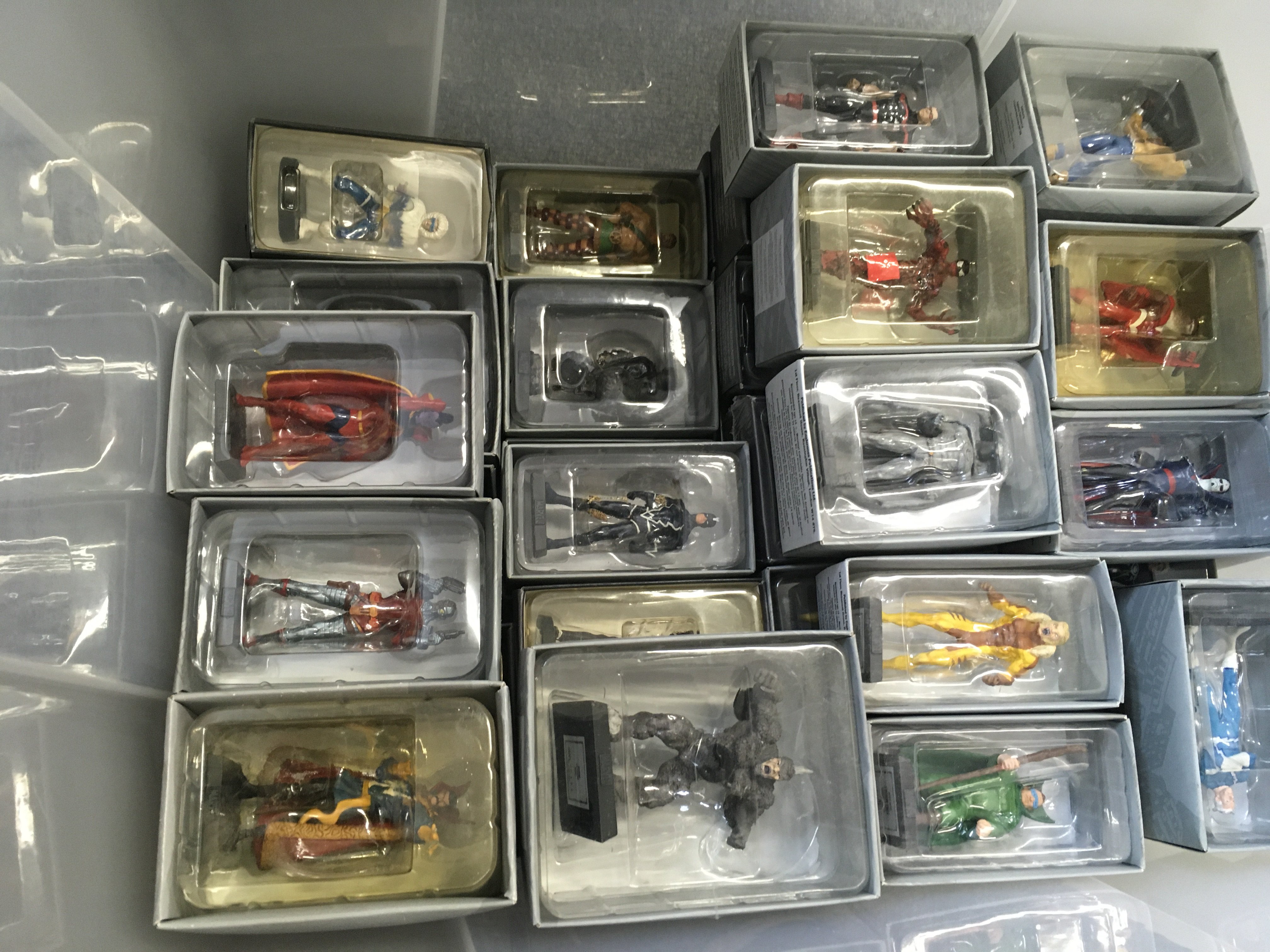 A collection of superhero model figures