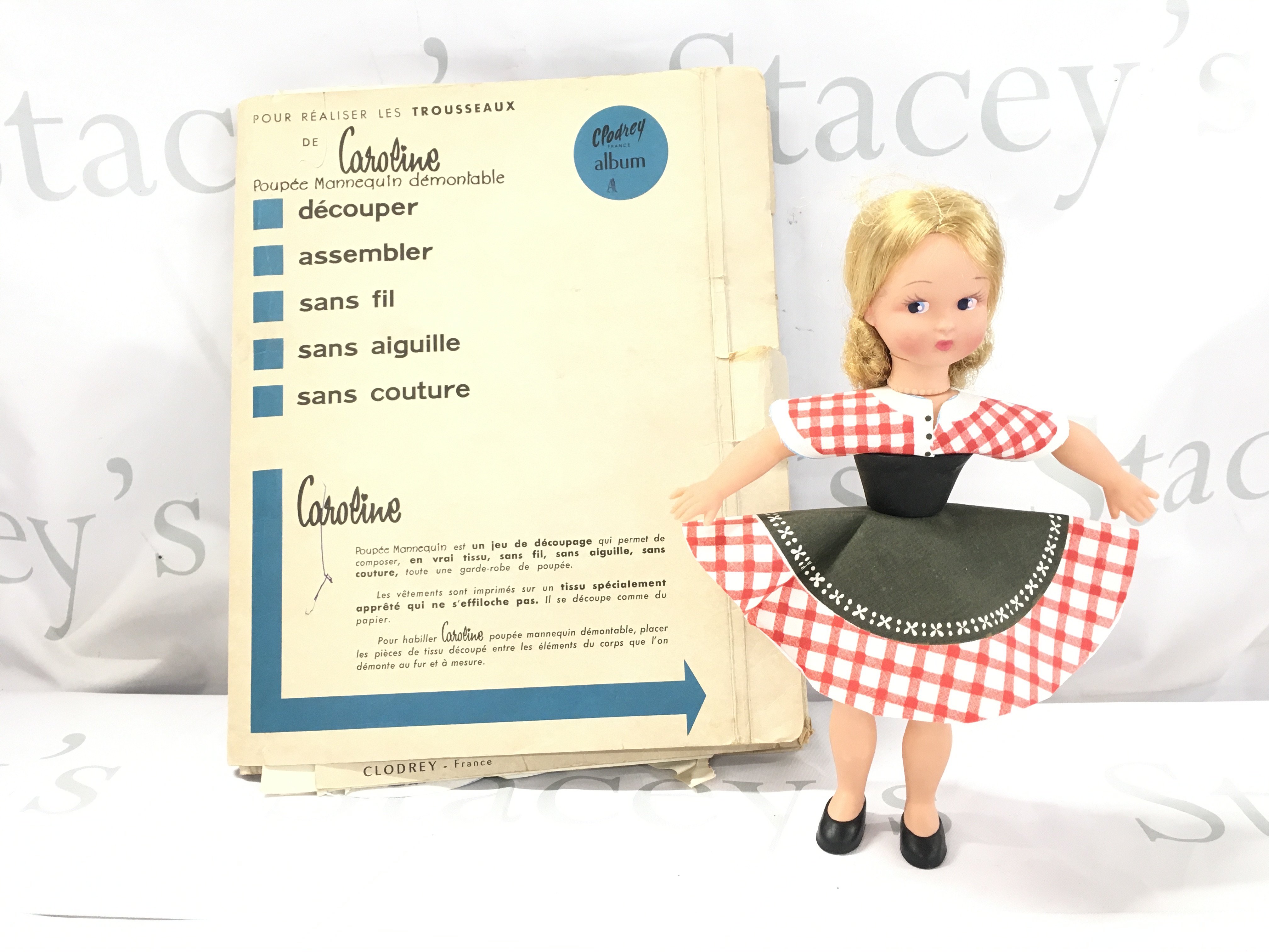 A Clodrey Caroline Doll With Folder Of Cut Out Clothes.
