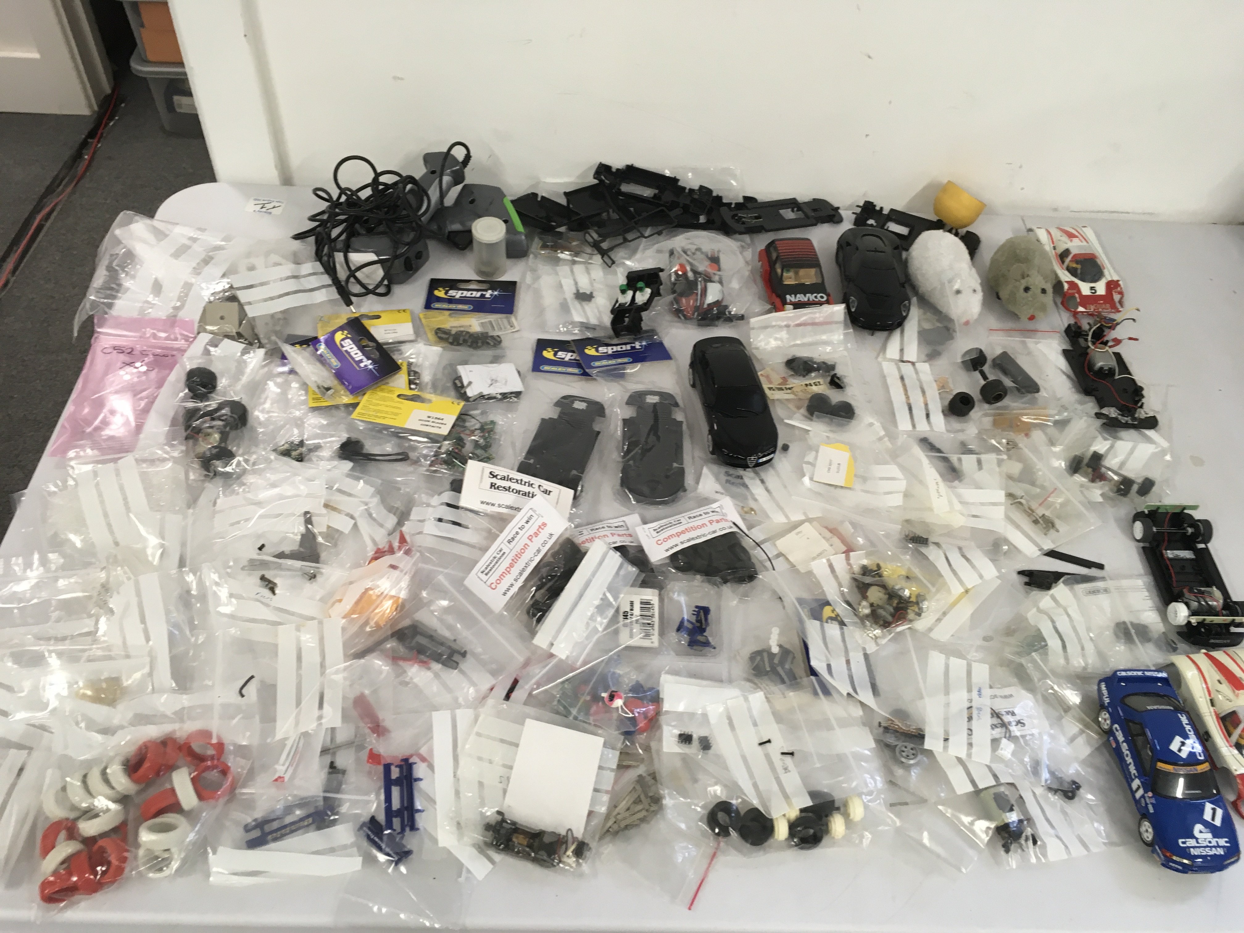 A large selection of Scalextric cars ..accessories..spares or repairs