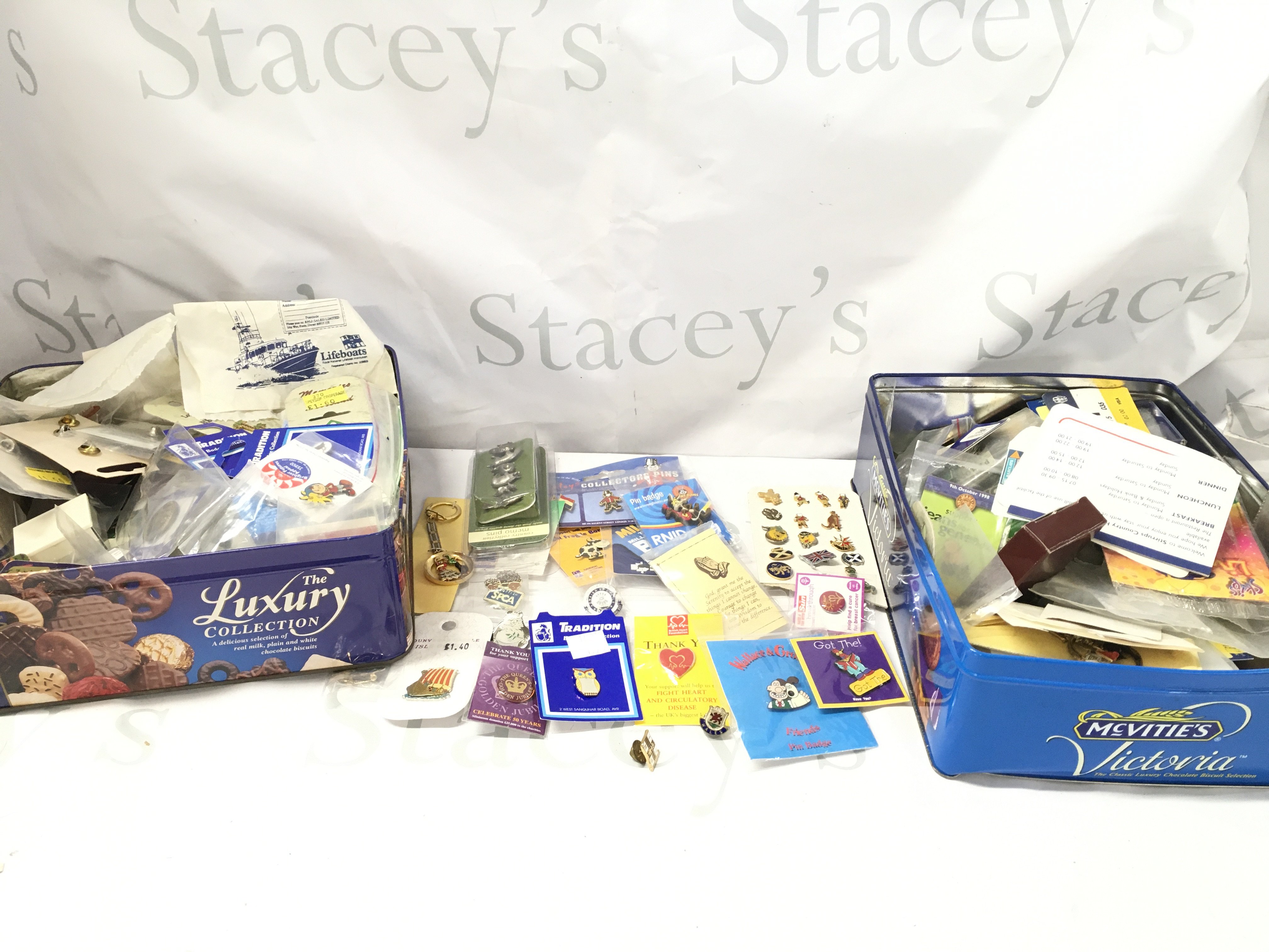 2 X Tins Containing Mostly Pin Badges. No Reserve (2).