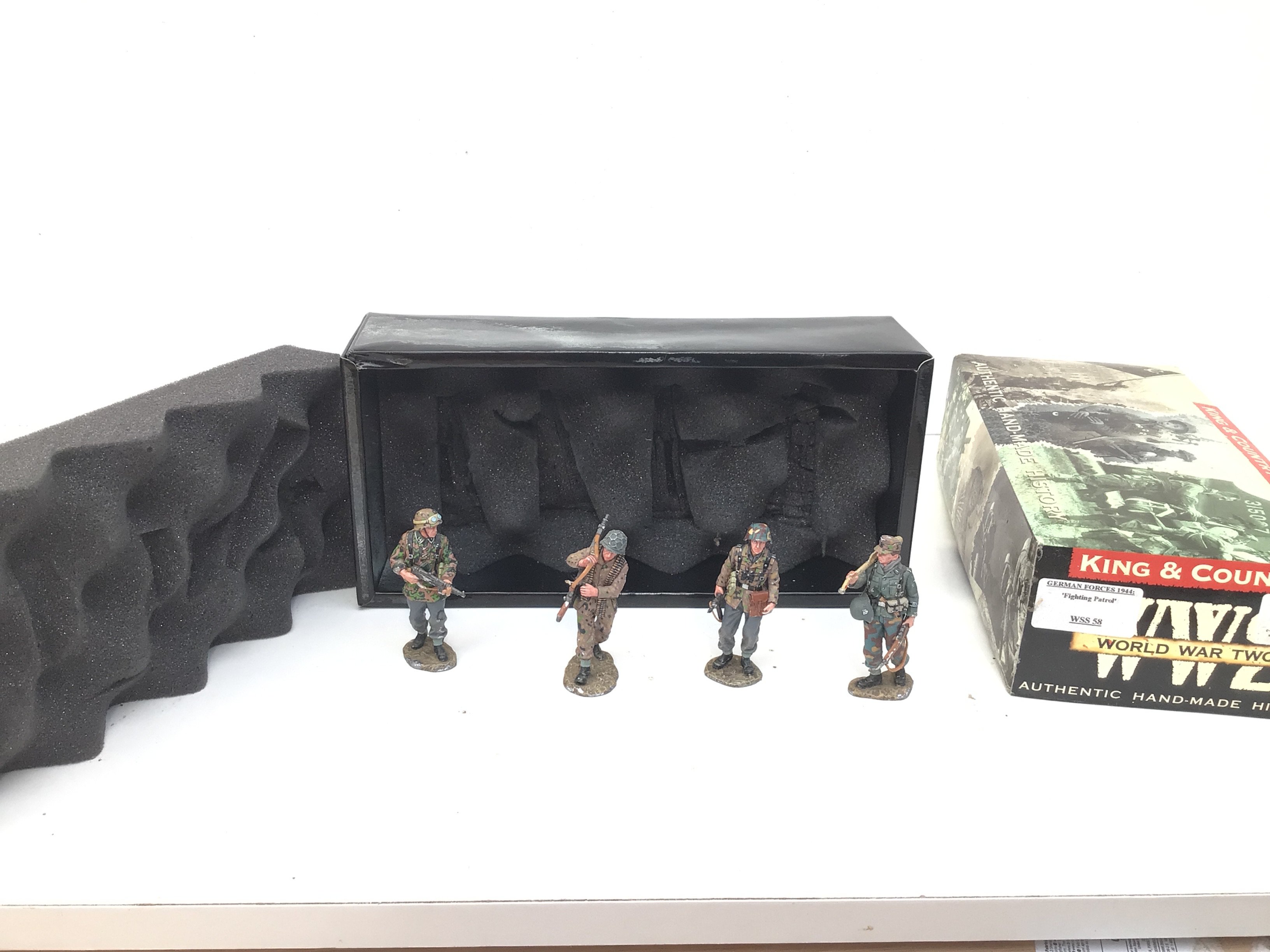 A boxed King and Country 4 figure set of miniature metal models featuring German Forces 1944 titled Fighting Patrol. No WSS58. No reserve.