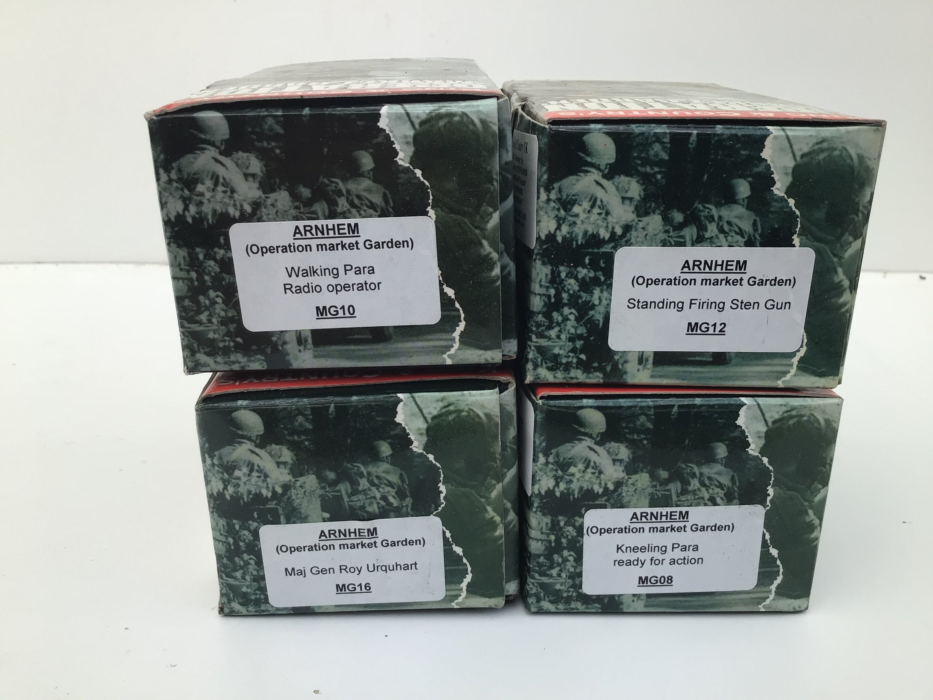 A collection of 4 boxed King and Country Minature Military models. Featuring the Arnhem Operation Market Garden series no.s MG08 ..MG10..MG12..MG12 and MG16. No reserve