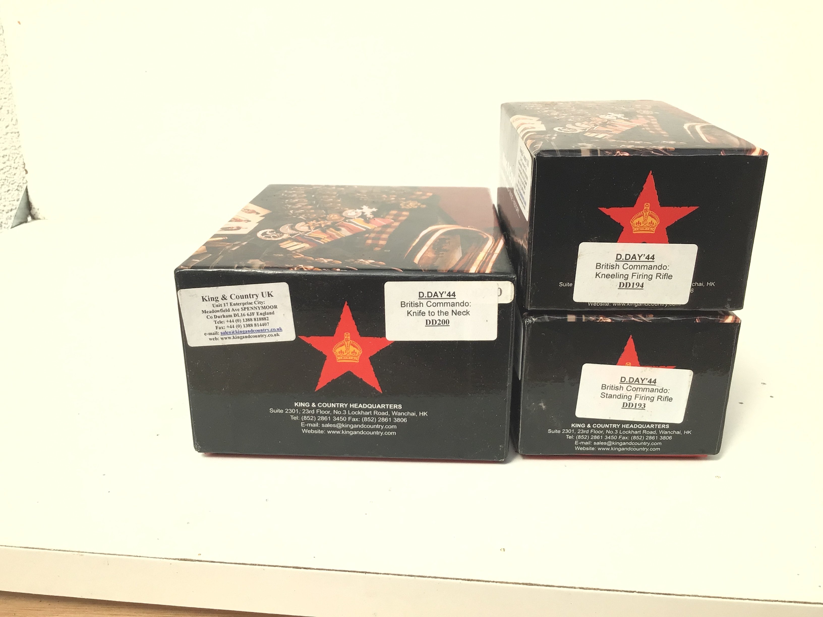 3 x boxed King and Country Minature Military models from the D Day 1944 Commando series. Featuring DD193. BC Standing firing rifle..DD 194 BC kneeling firing rifle..DD200 BC Knife to the neck. No reserve.