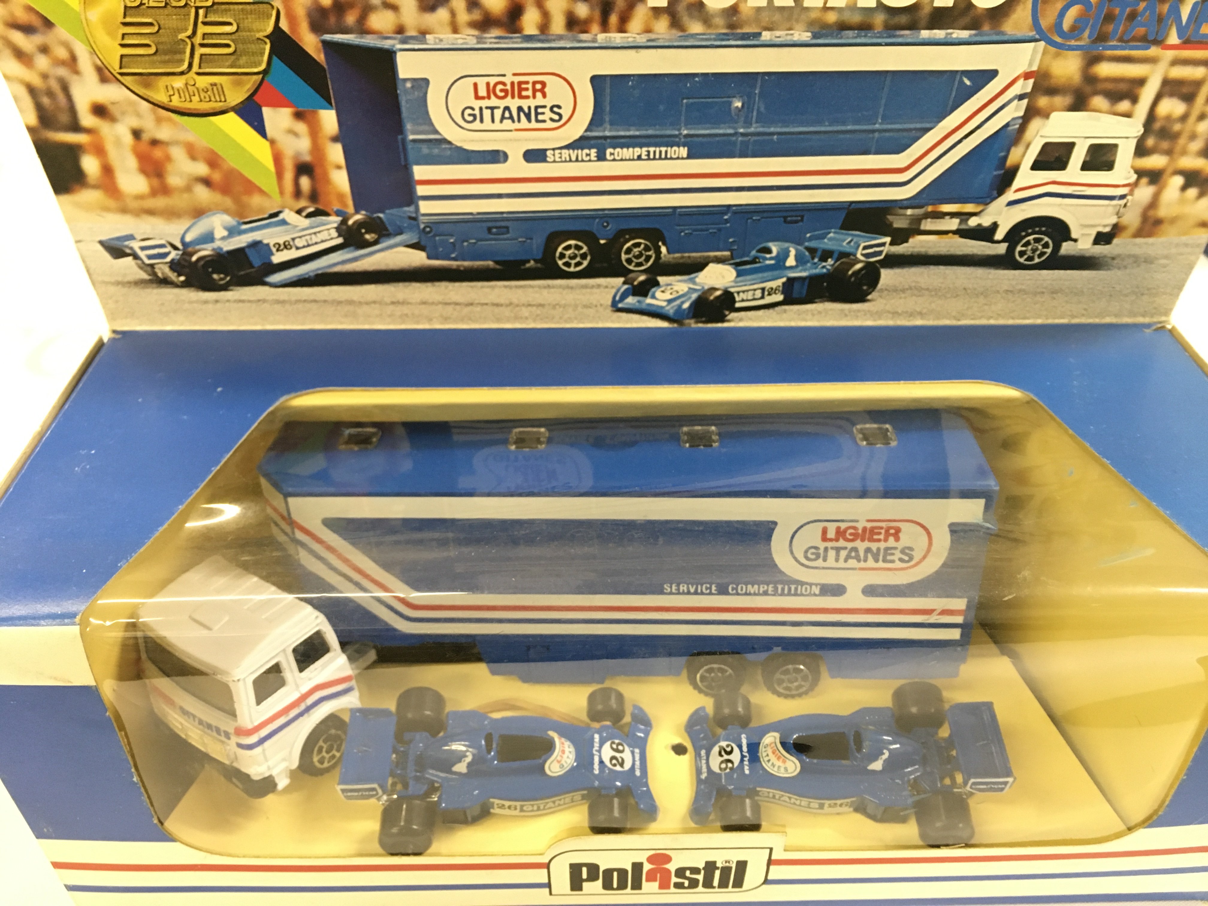 A Boxed Polistil Fiat F1 Transporter with 2 Ligier Gitanes Cars.