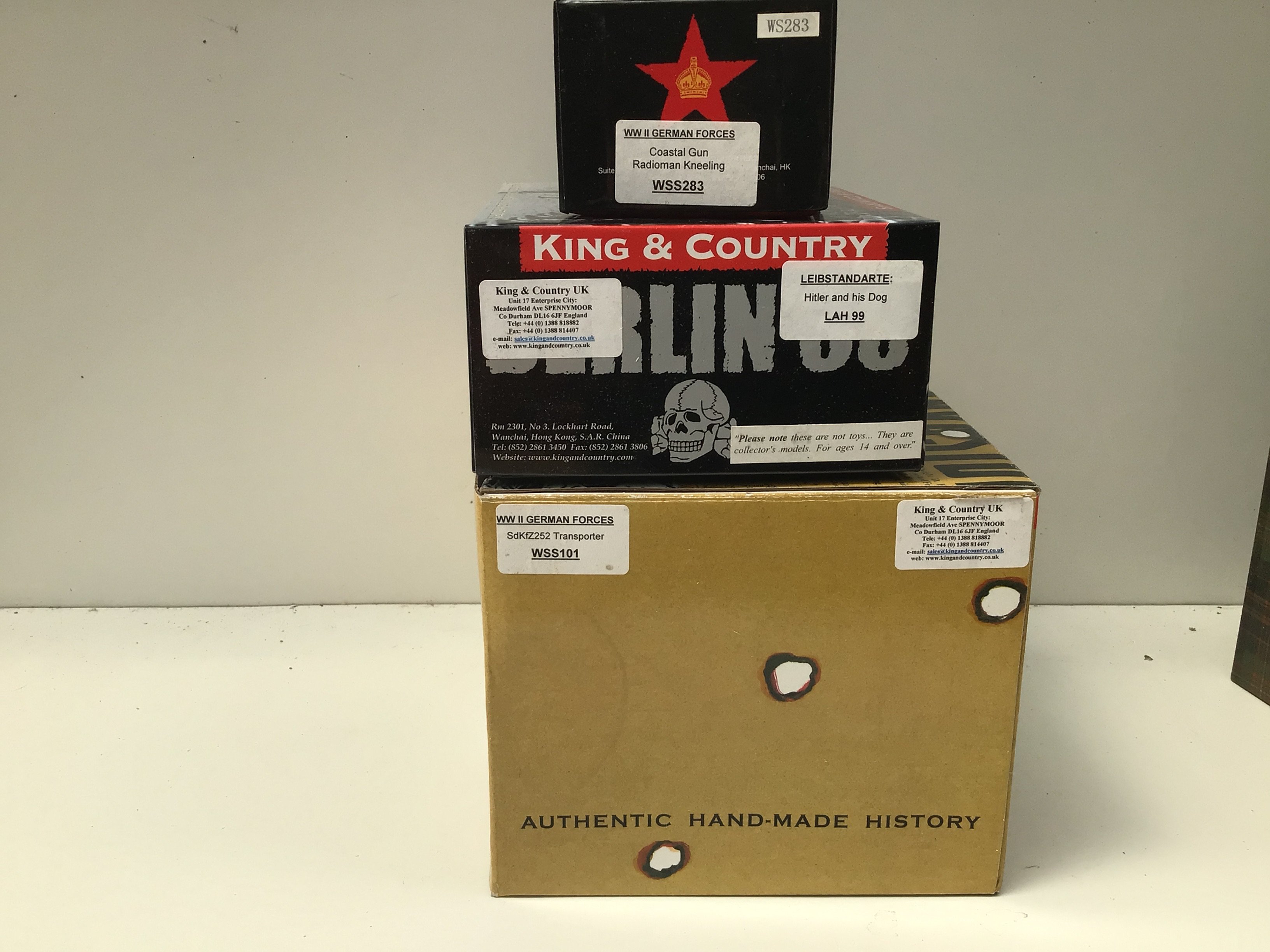 3 x boxed King and Country Minature Military models featuring German For es. Includes WSS101 Transporter. WSS283 Coastal gun Radioman kneeling..LAH99. Hitler and his dog. No reserve