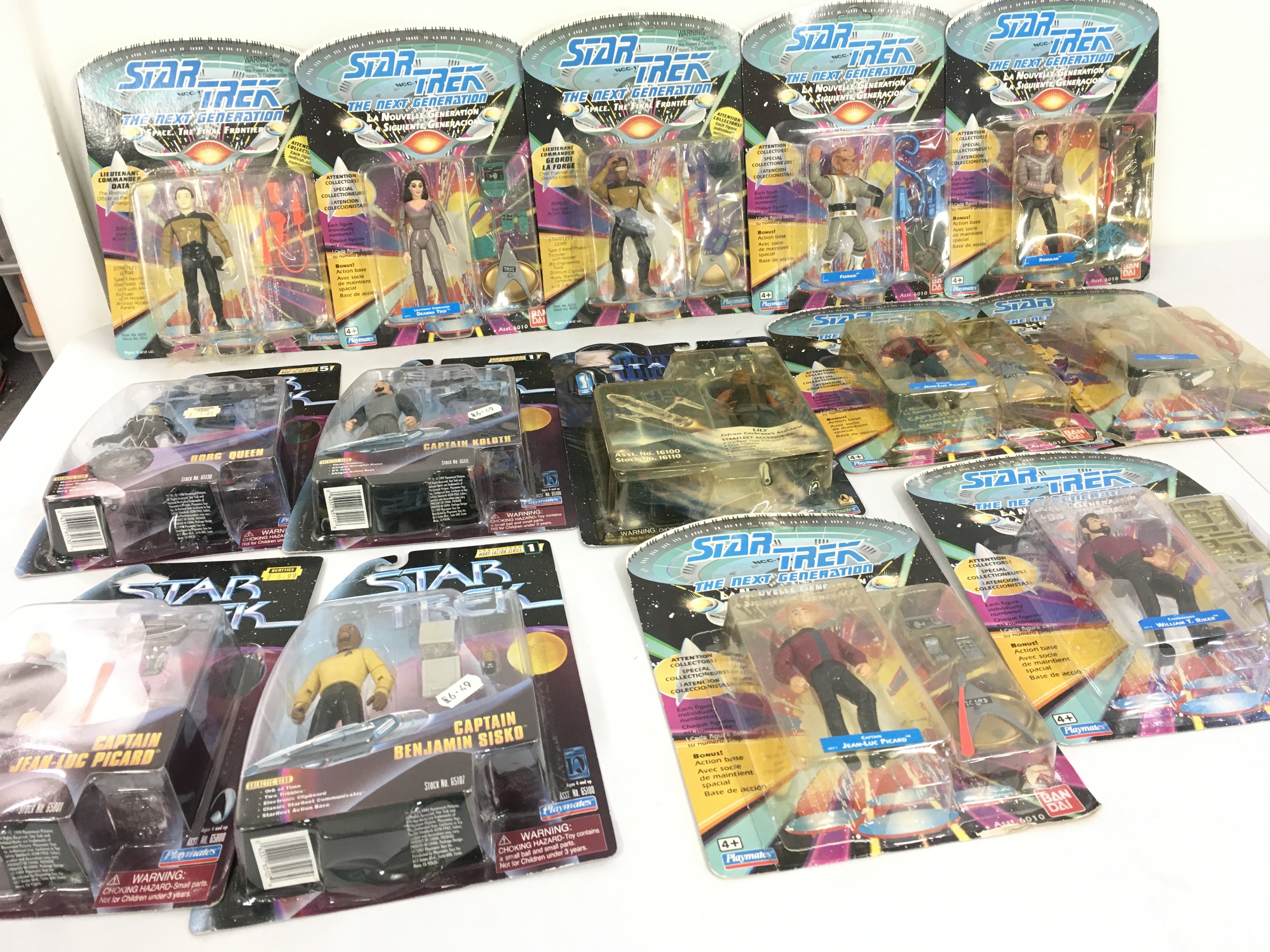 A collection of 14 carded Star Trek action figures by Playmates mostly unopened. Includes The Next Generation and Warp Factor 1 series plus First Contact. No reserve.