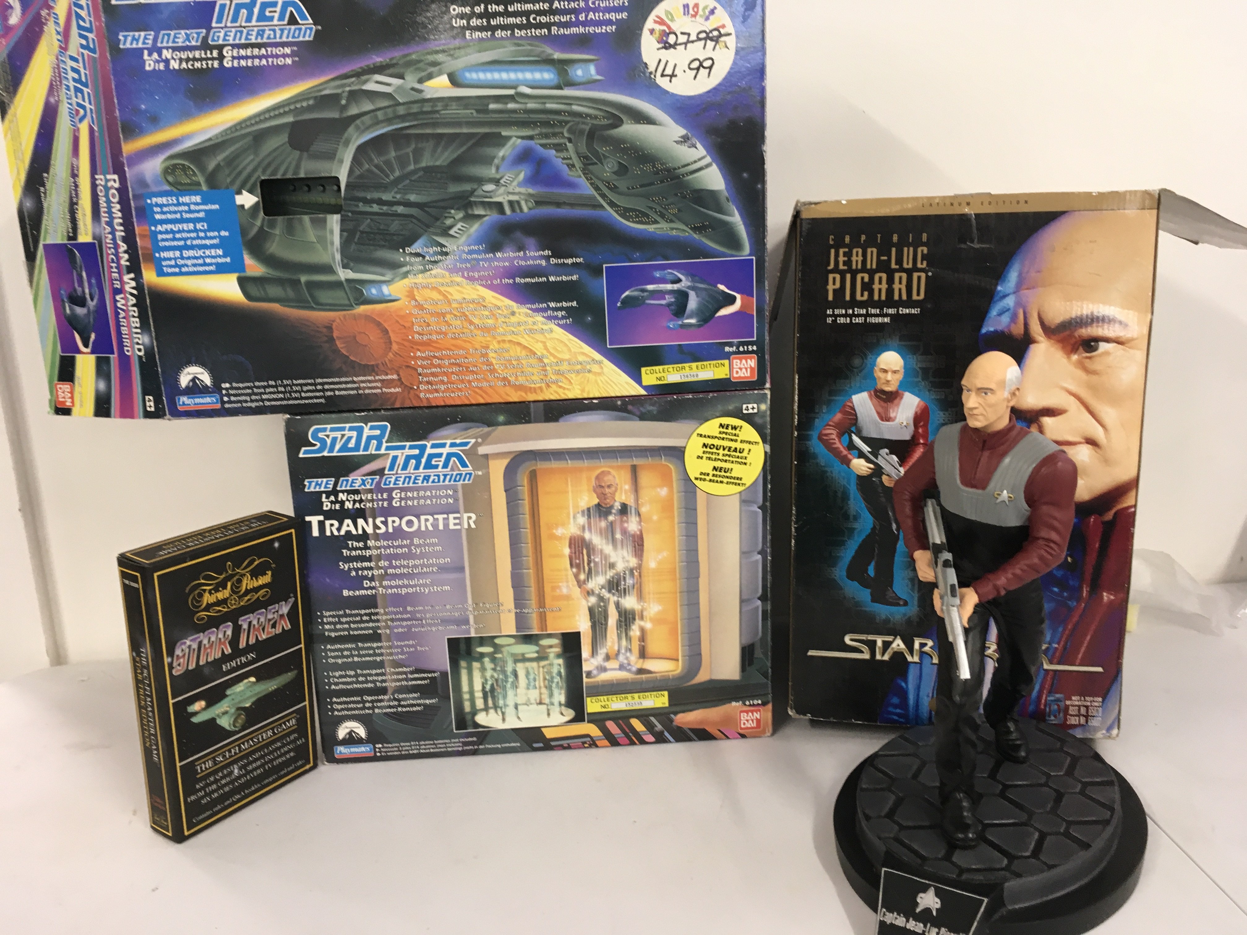 A collection of Star Trek boxed items including a Romulan Warbird.. Transporter toys plus a trivial pursuit. A boxed 12 inch cold cast figurine of Jean luc Picard. No 0001 of 5000 limited edition. No reserve