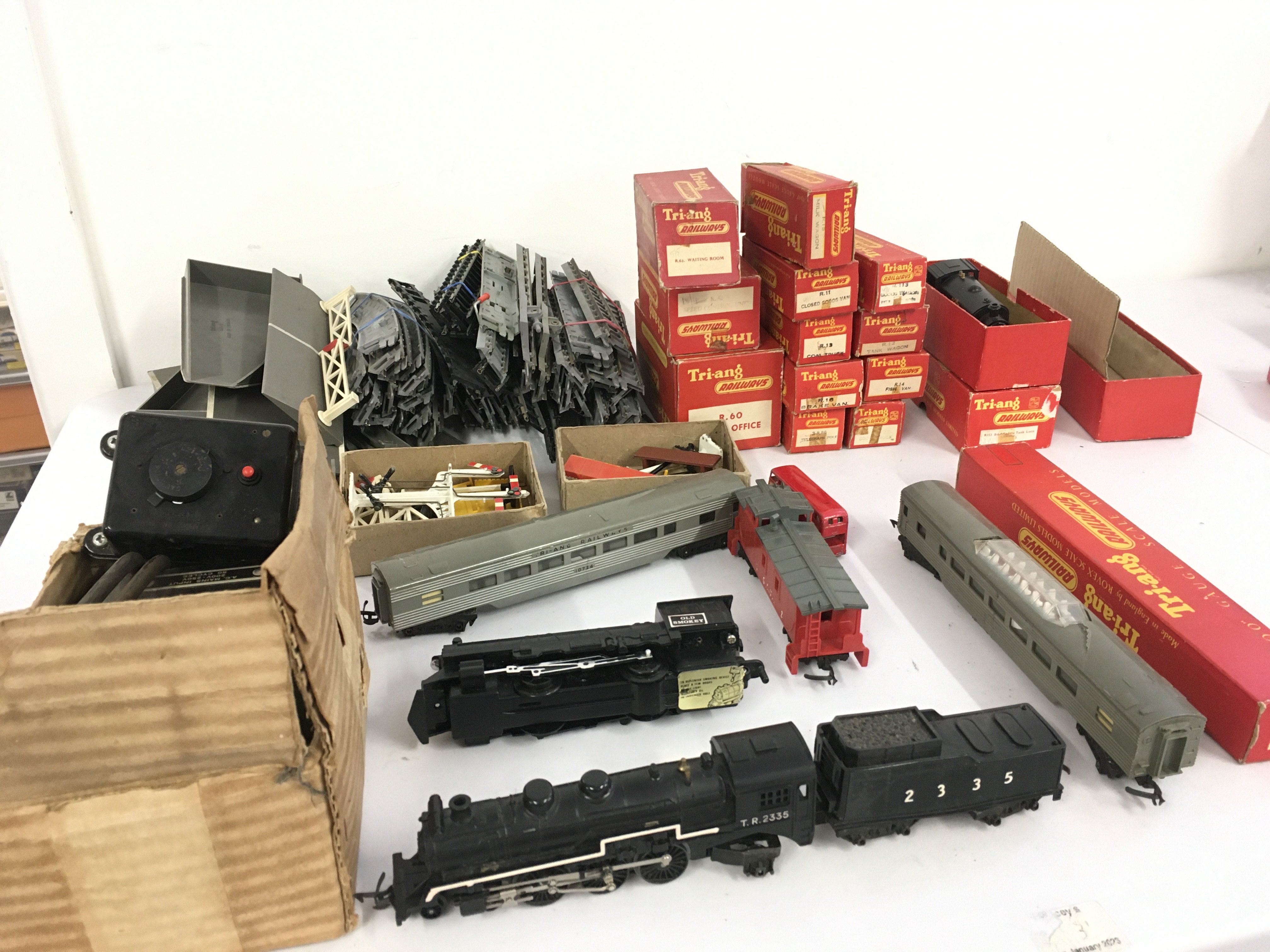 A collection of 00 gauge model railway including locos..coaches..wagons..track and accessories. No reserve
