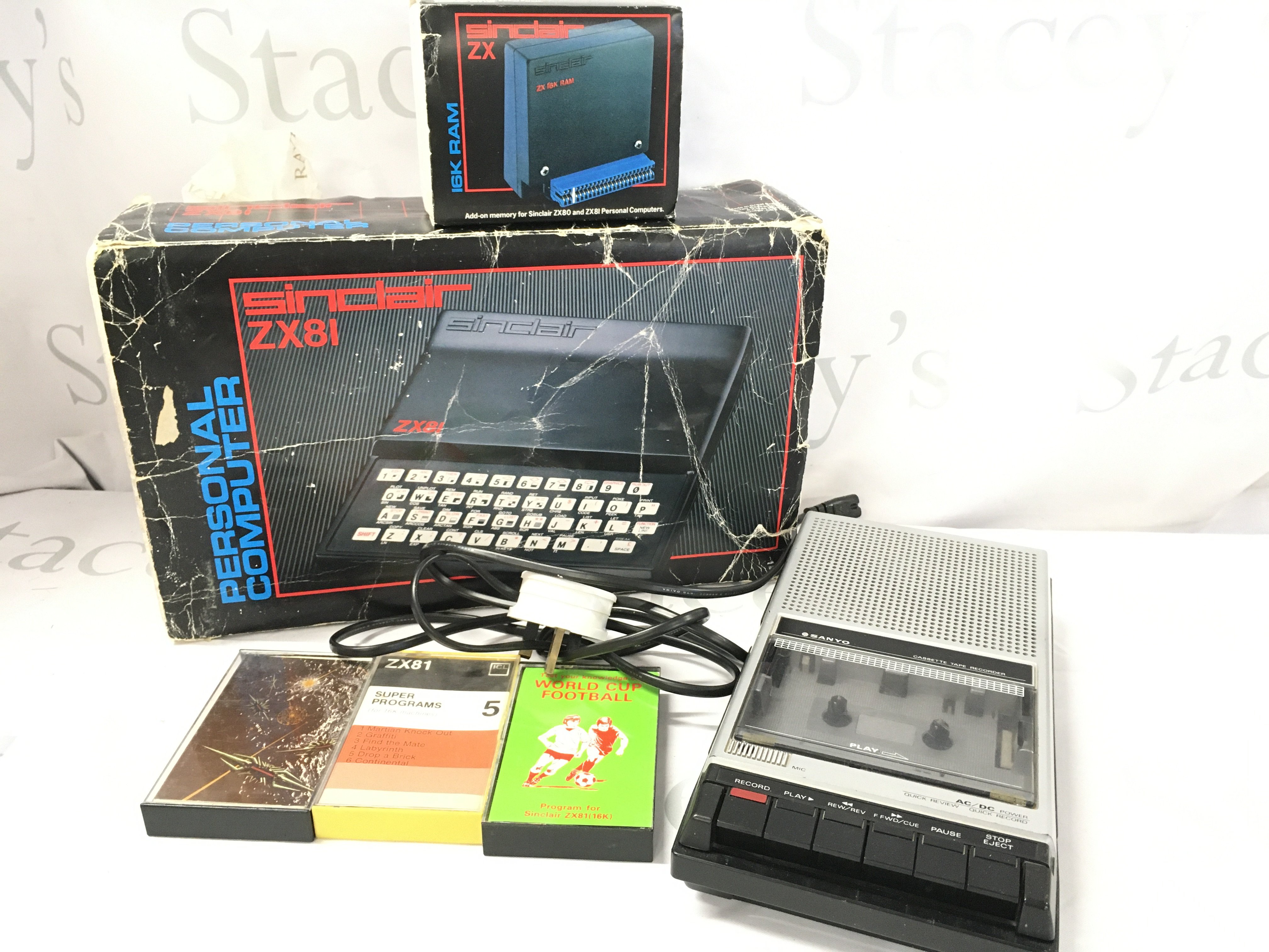 A Boxed Sinclair ZX81 With 16K Ram. A Sanyo Cassette Recorder and Software.