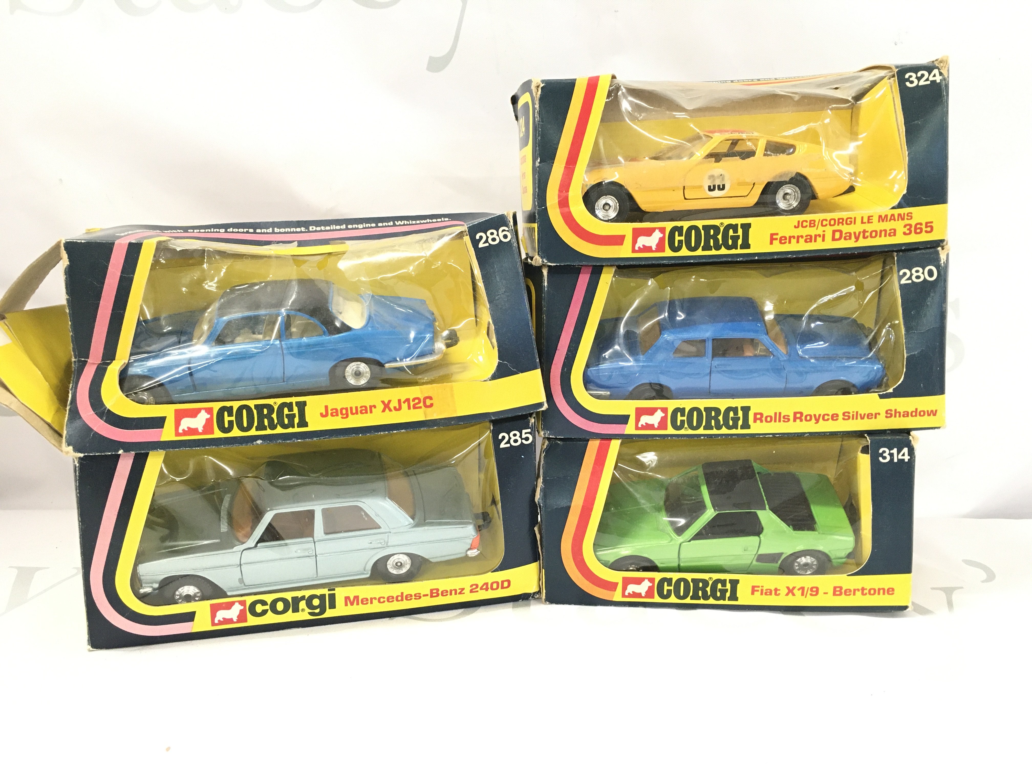 5 Boxed Corgi Diecast Vehicles. A Jaguar XJ12C #286. A Ferrari Daytona #324. A Mercedes-Benz 240D #285 A Rolls Royce Silver Shaddow #280 And A Fiat X1/9-Bertone #314.