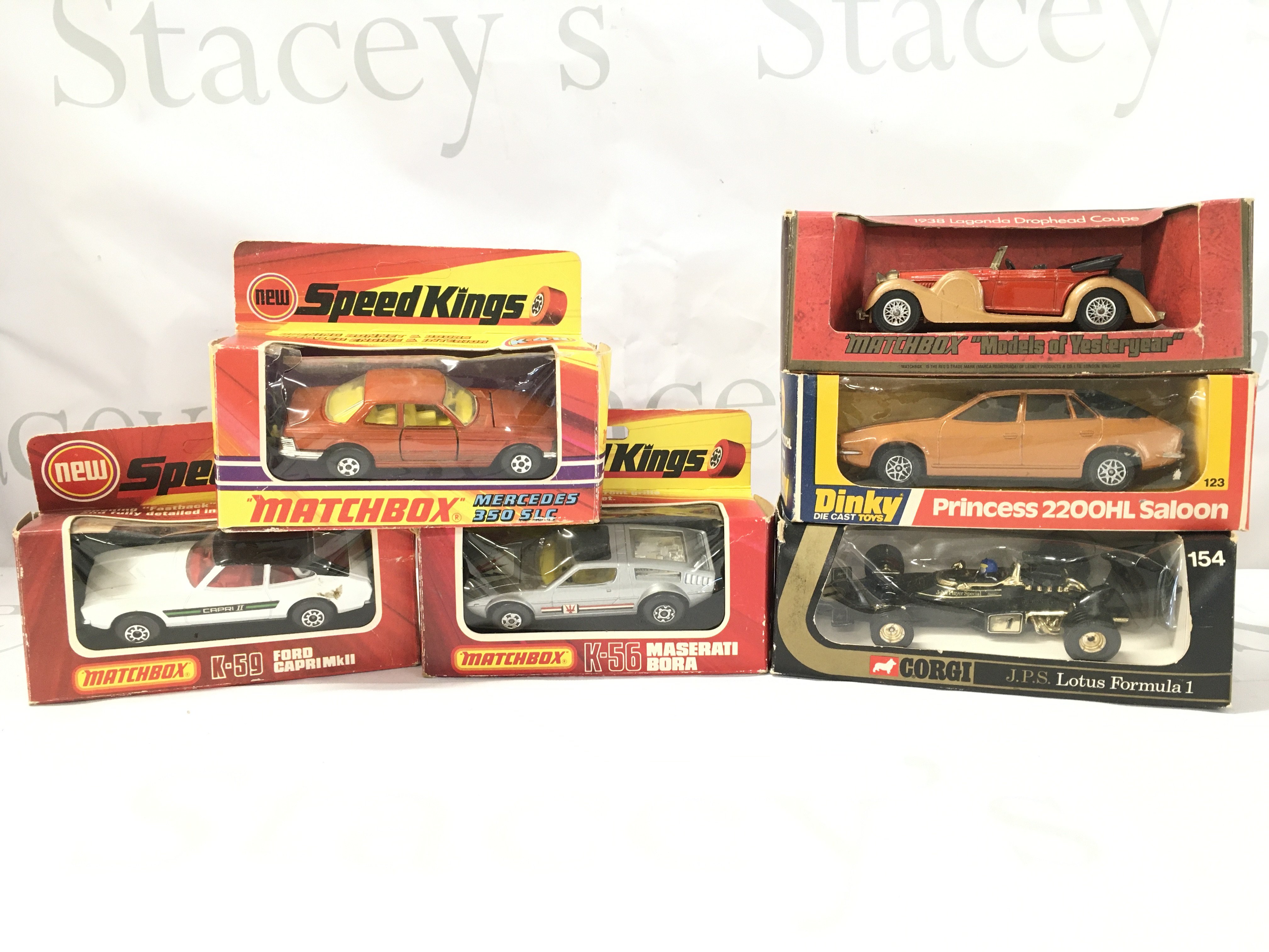 3 Boxed Matchbox Speed Kings. A Mercedes 350 5LC. A Ford Capri MK II. A Maserati Bora. And A Corgi JPS Lotus F1. A Dinky Princess 2200HL Saloon And. A Matchbox 1938 Luganda Drophead Coupe. Boxes In Various States.