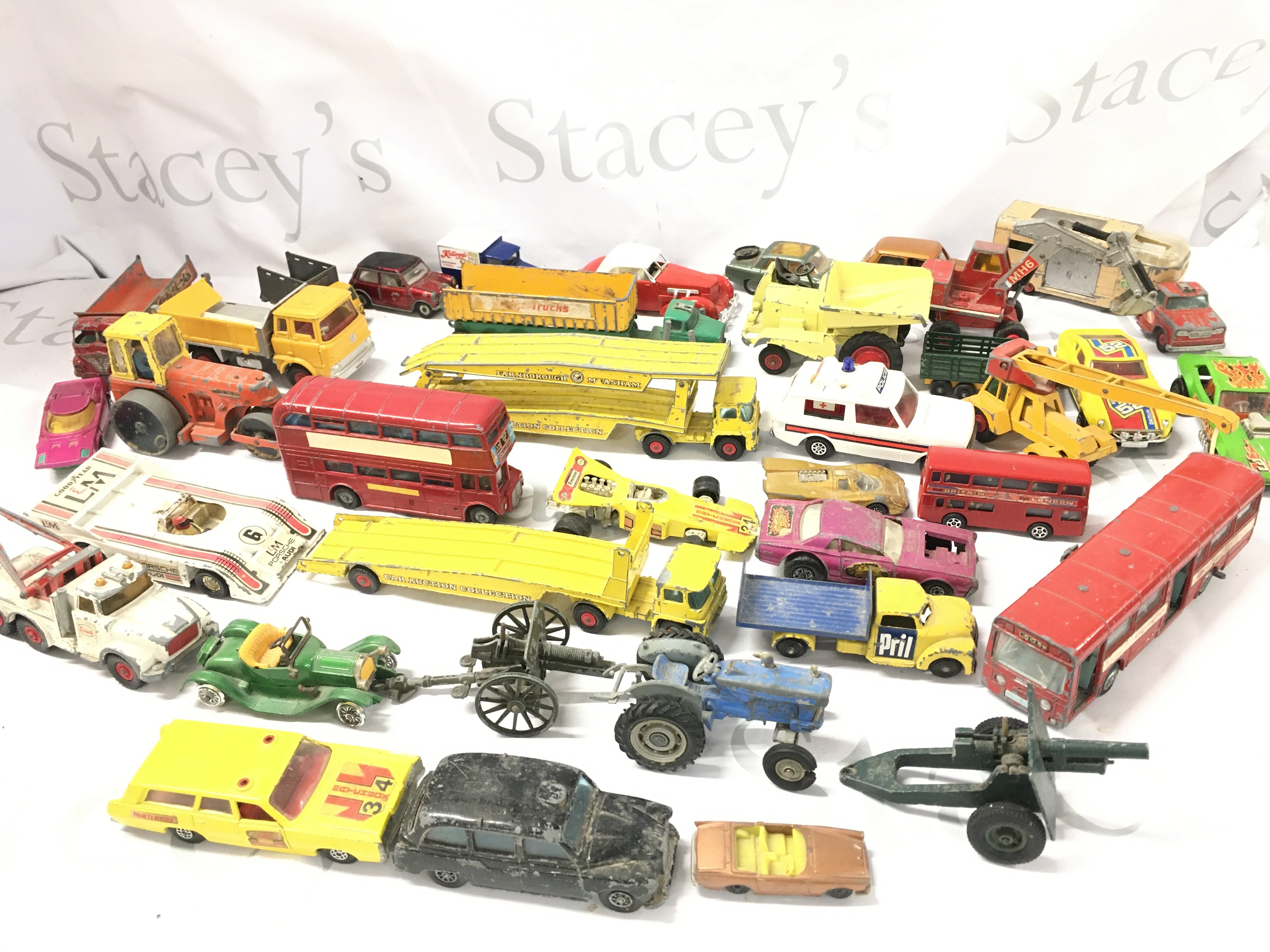 A Box Containing Playworn Diecast. Includes Matchbox. Dinky And Corgi.