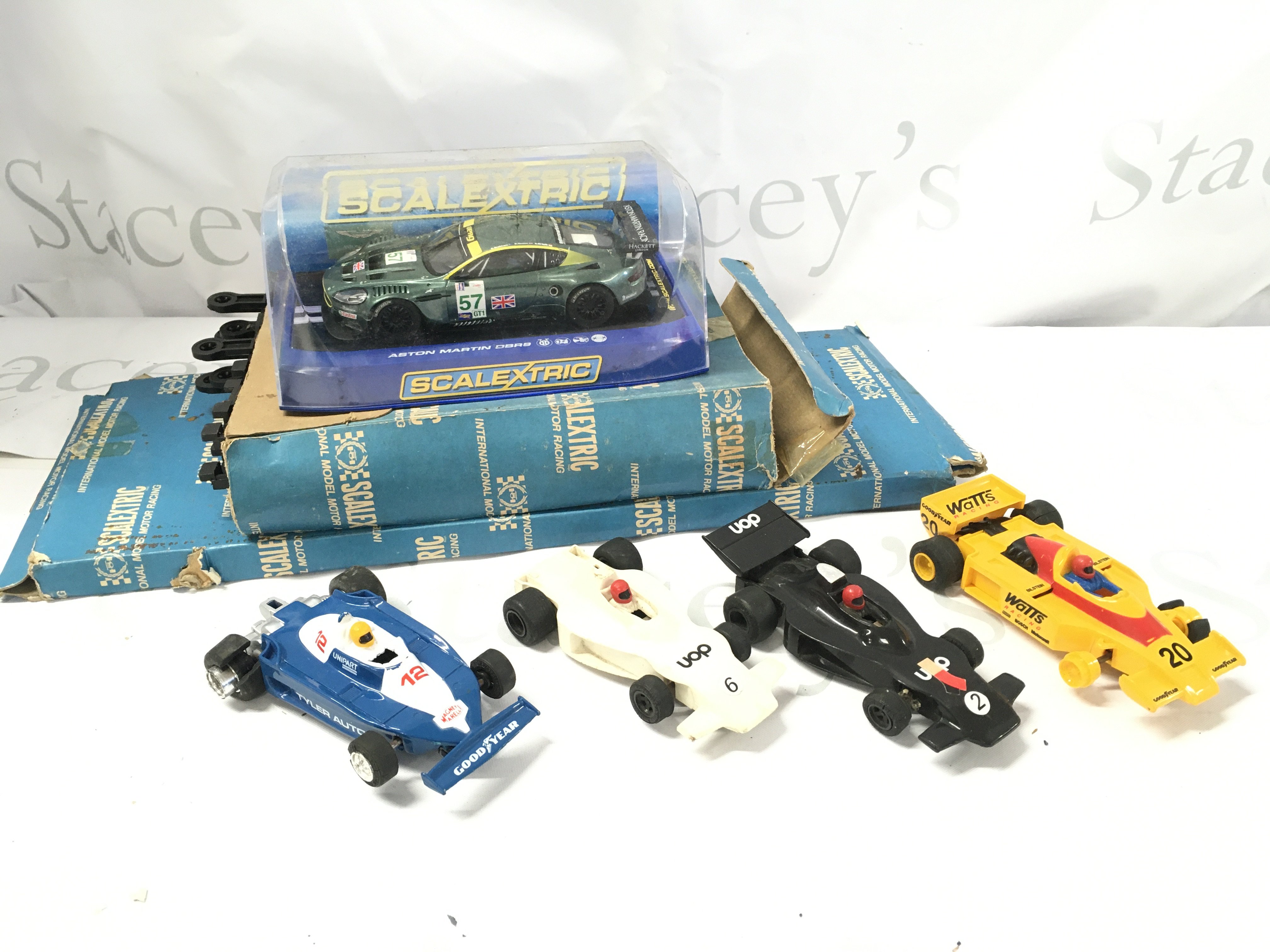 A Box Containing A Collection of Various Scalextric Parts and Spares Including A Boxed Aston Martin DBR9