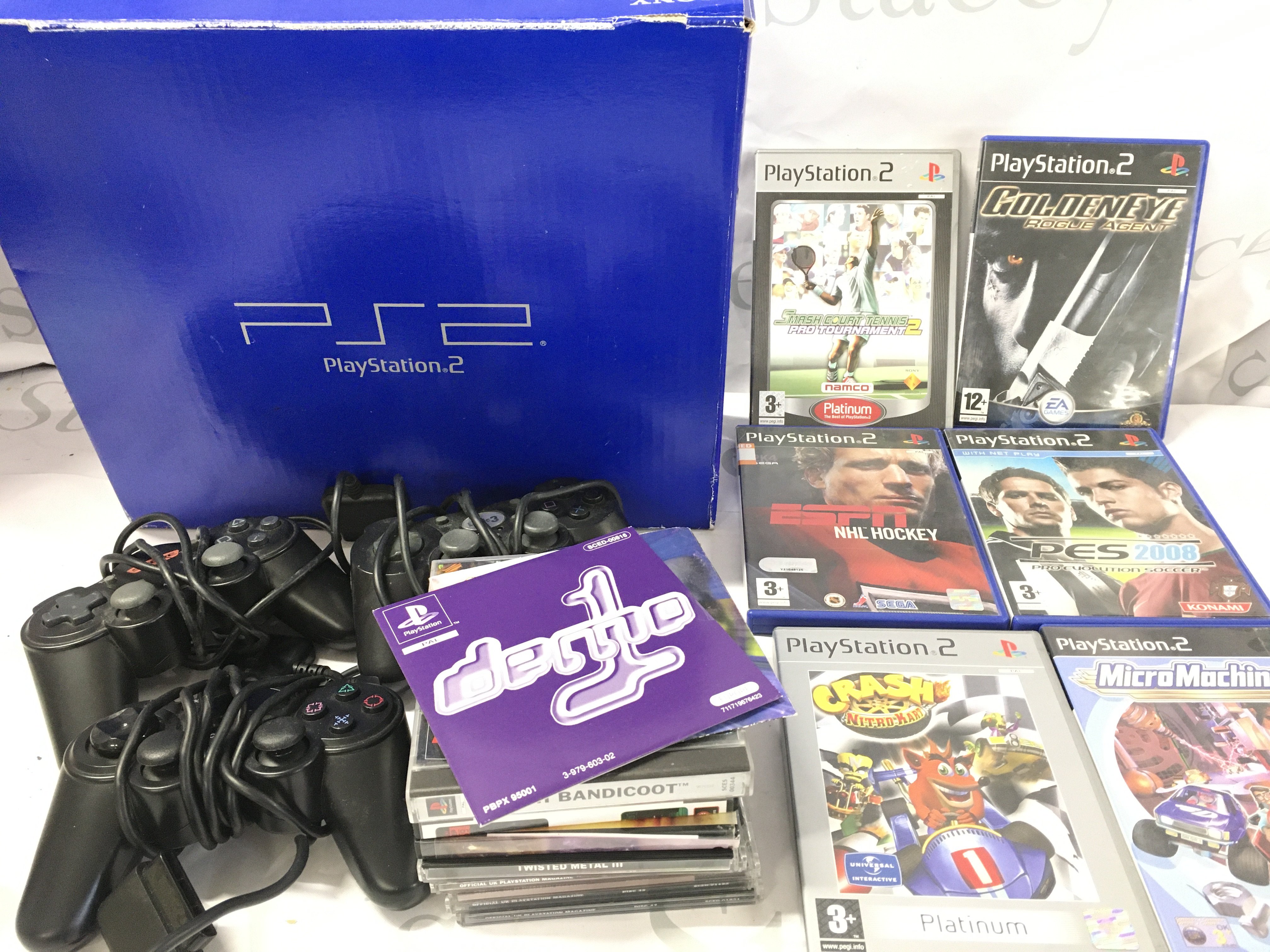 A Boxed Sony PlayStation 2 with 5 Controllers.Memory Card etc. No Reserve.