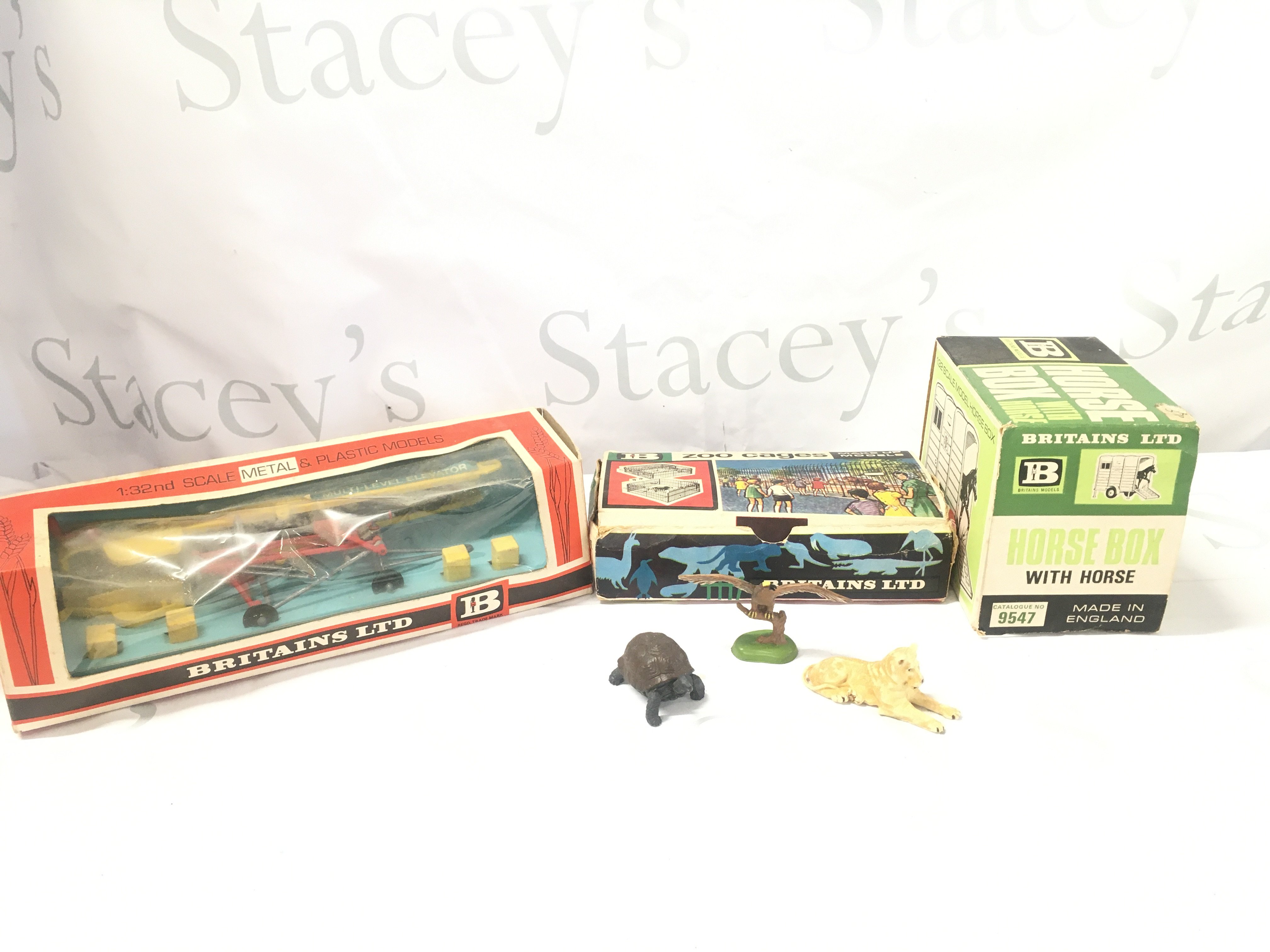 A Boxed Britains Elevator #9564. Zoo Cages And Horse Box with Horse #9547.