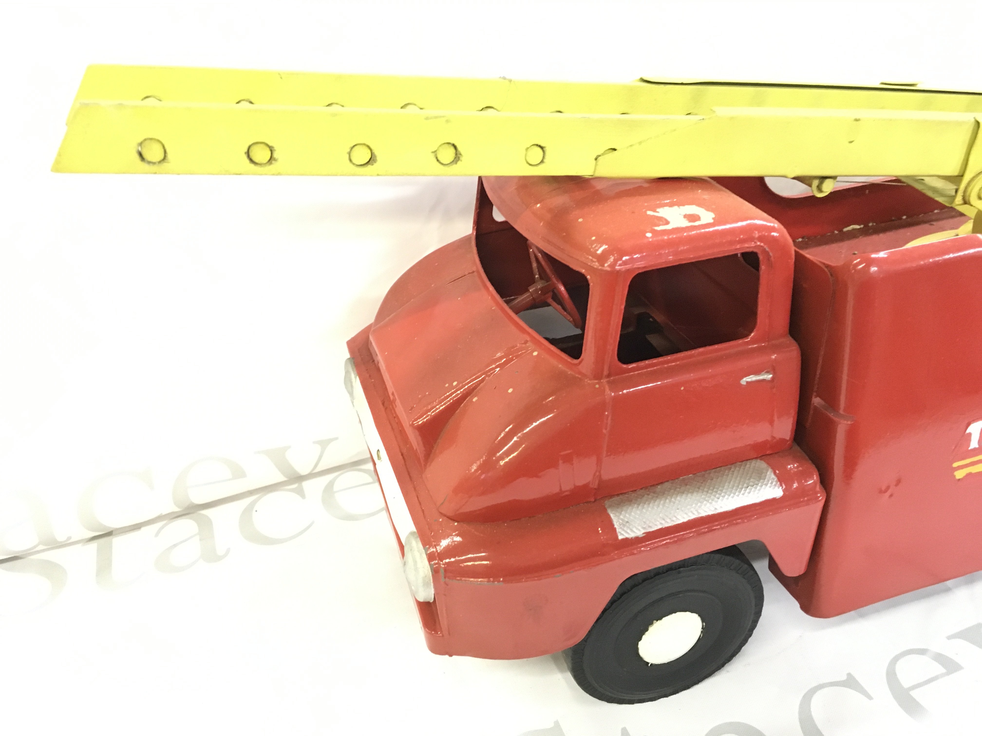 A Tri-Ang Pull Along Fie Truck.