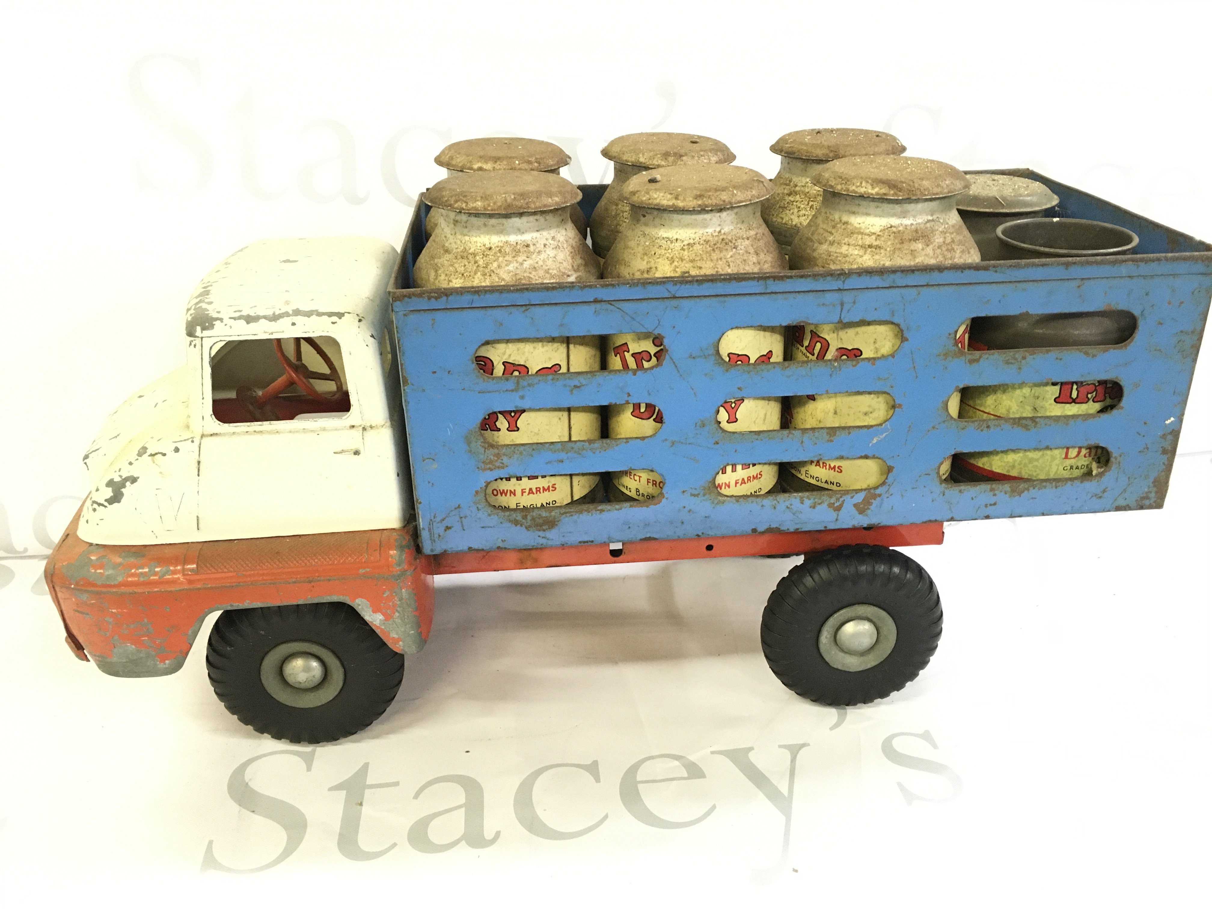 A Tri-Ang Milk Truck With Churns.