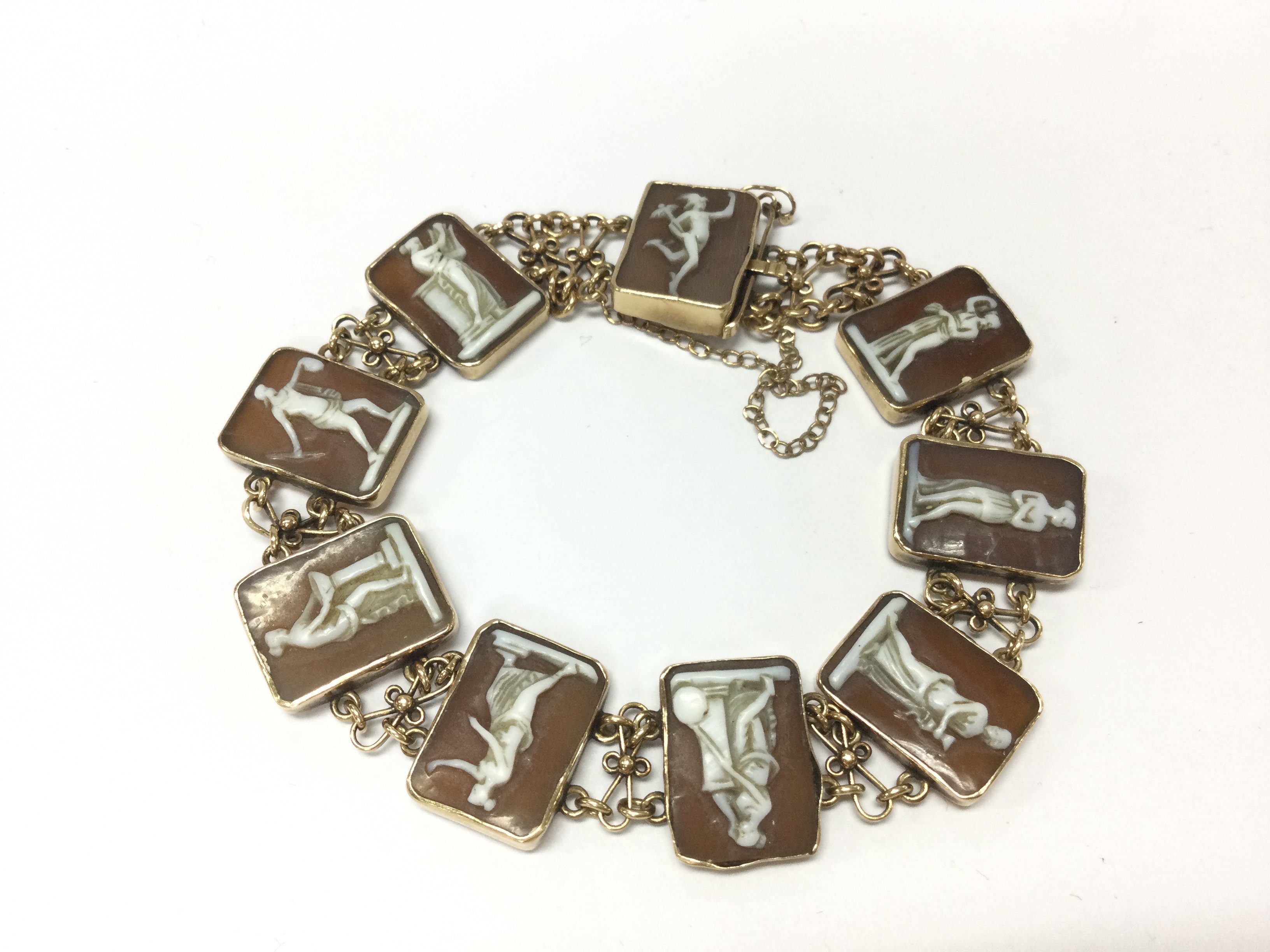 A 9ct gold and cameo grand tour bracelet. 17.35g