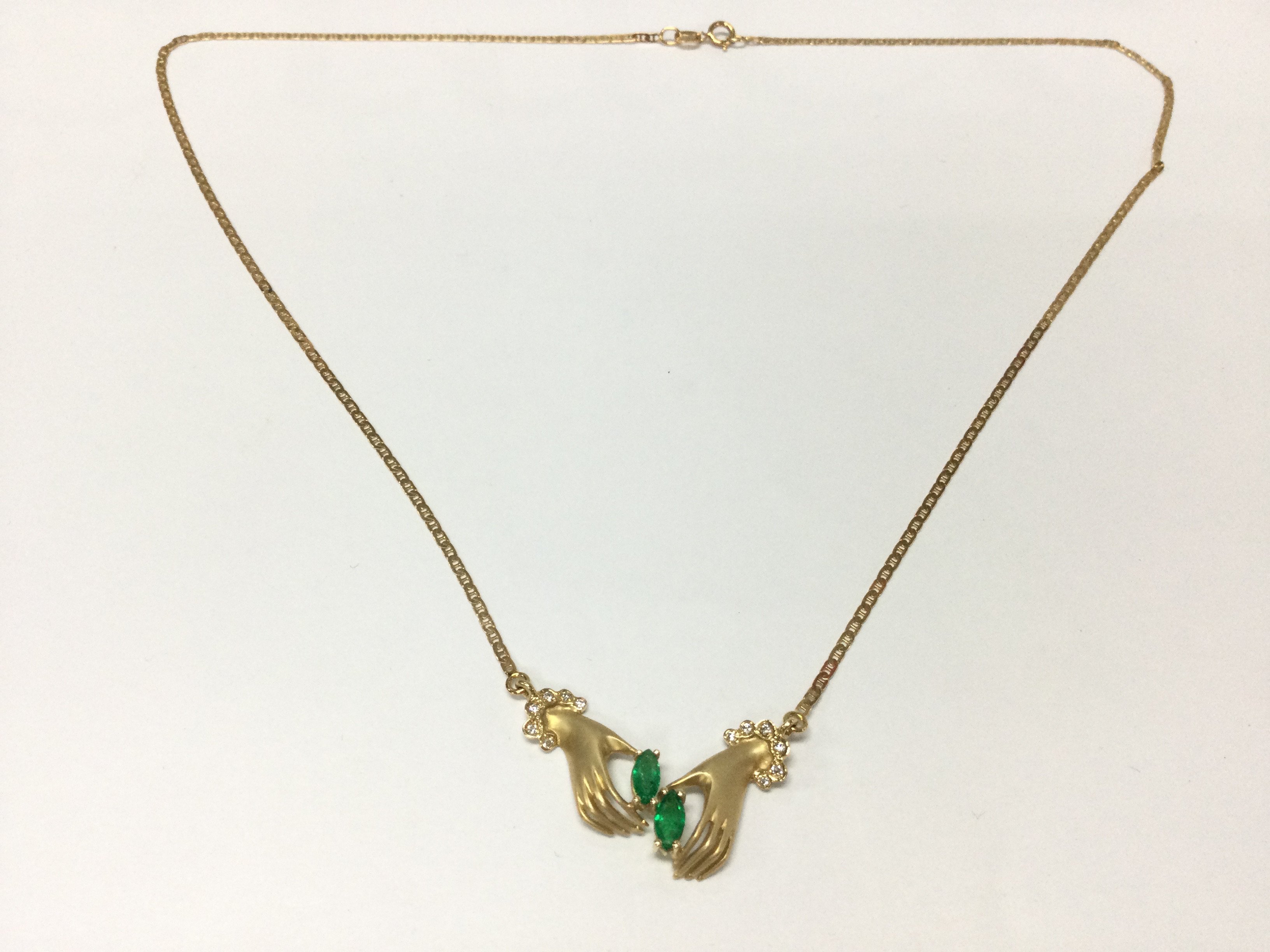 14ct gold necklace with 2 Colombian green emeralds and pave set diamonds. 4.23g
