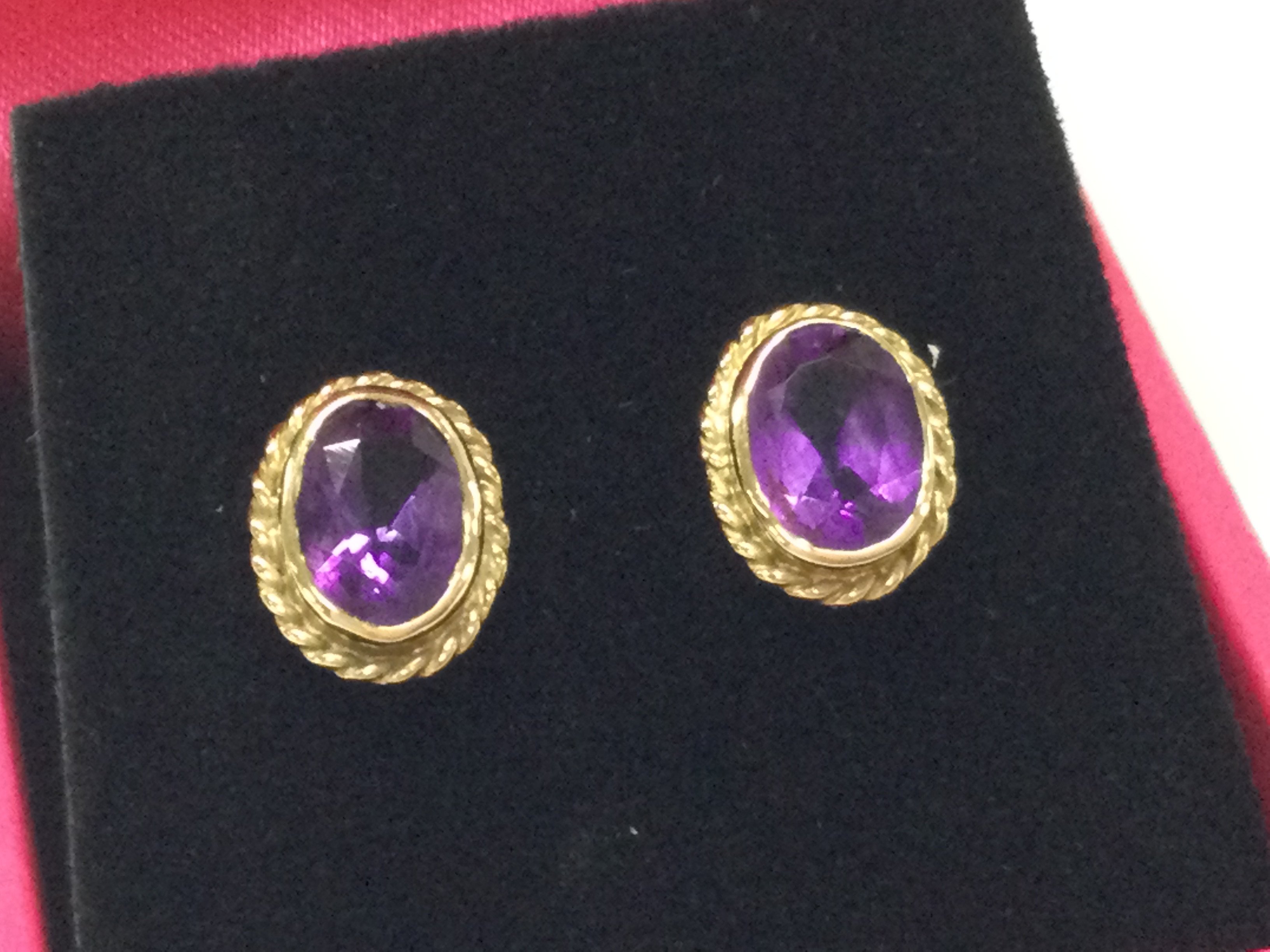 A pair of 9ct amethyst earrings. Postage B