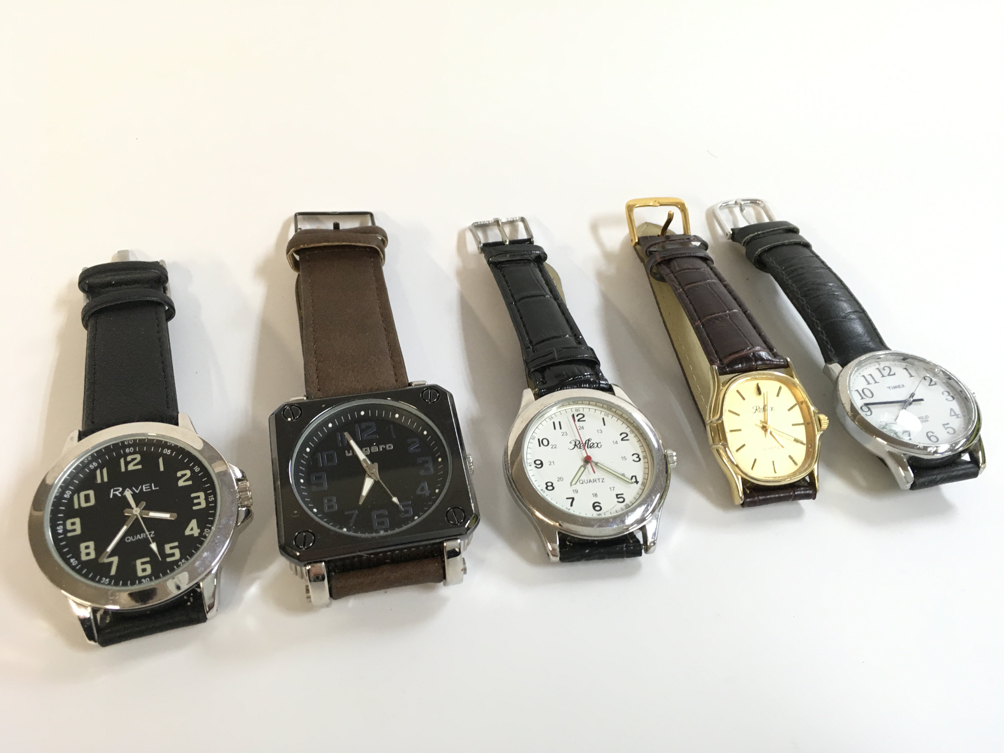 Five vintage quartz watches, seen working. Postage category a