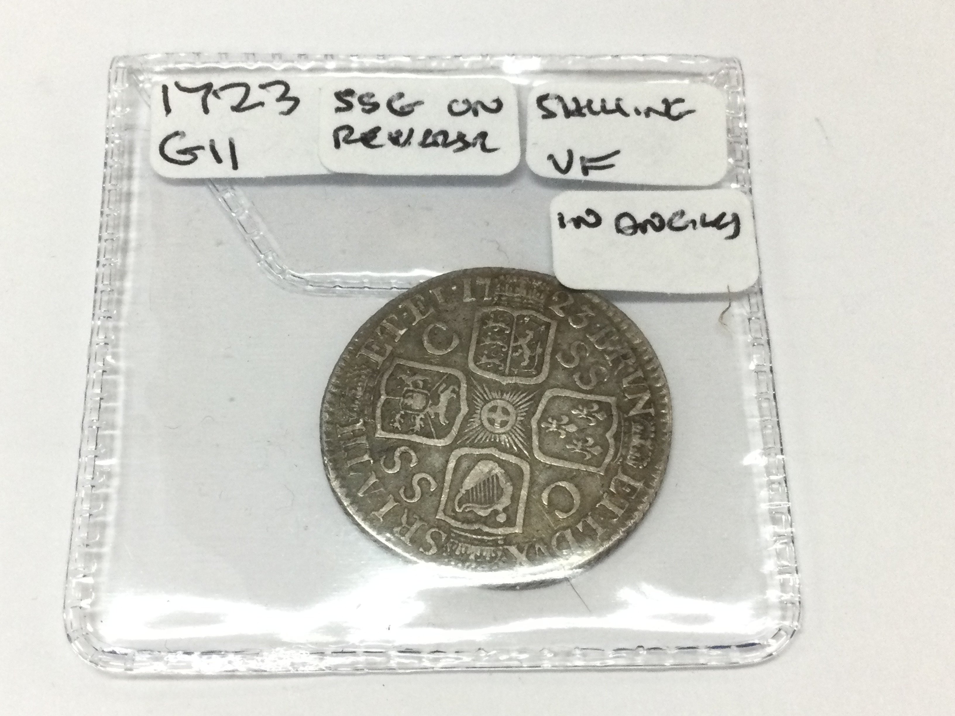 A 1723 GII shilling. Postage A