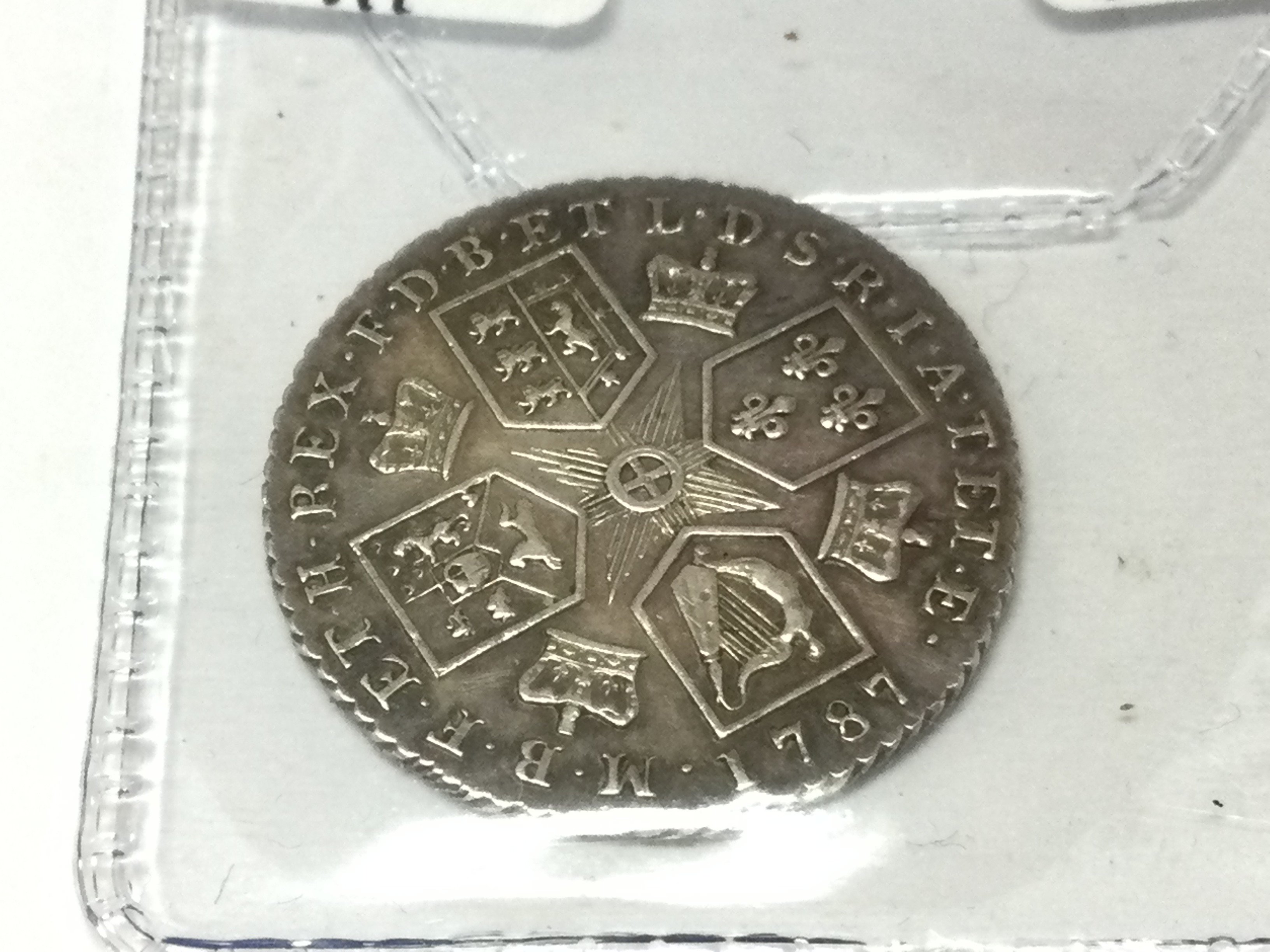 A 1787 GII shilling. Postage A