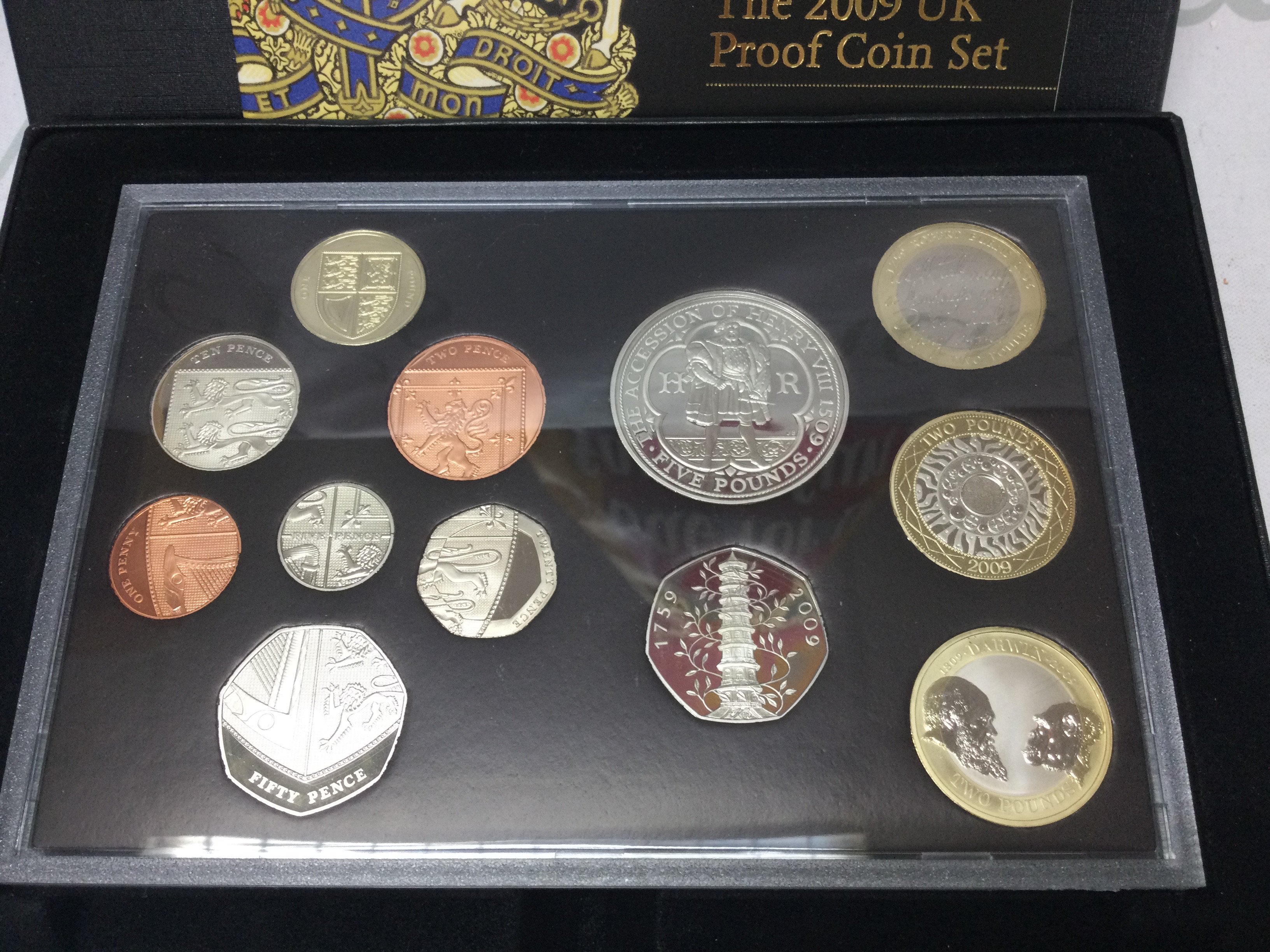 A 2009 Royal mint UK proof coin set which includes the Kew Gardens 50p Postage B