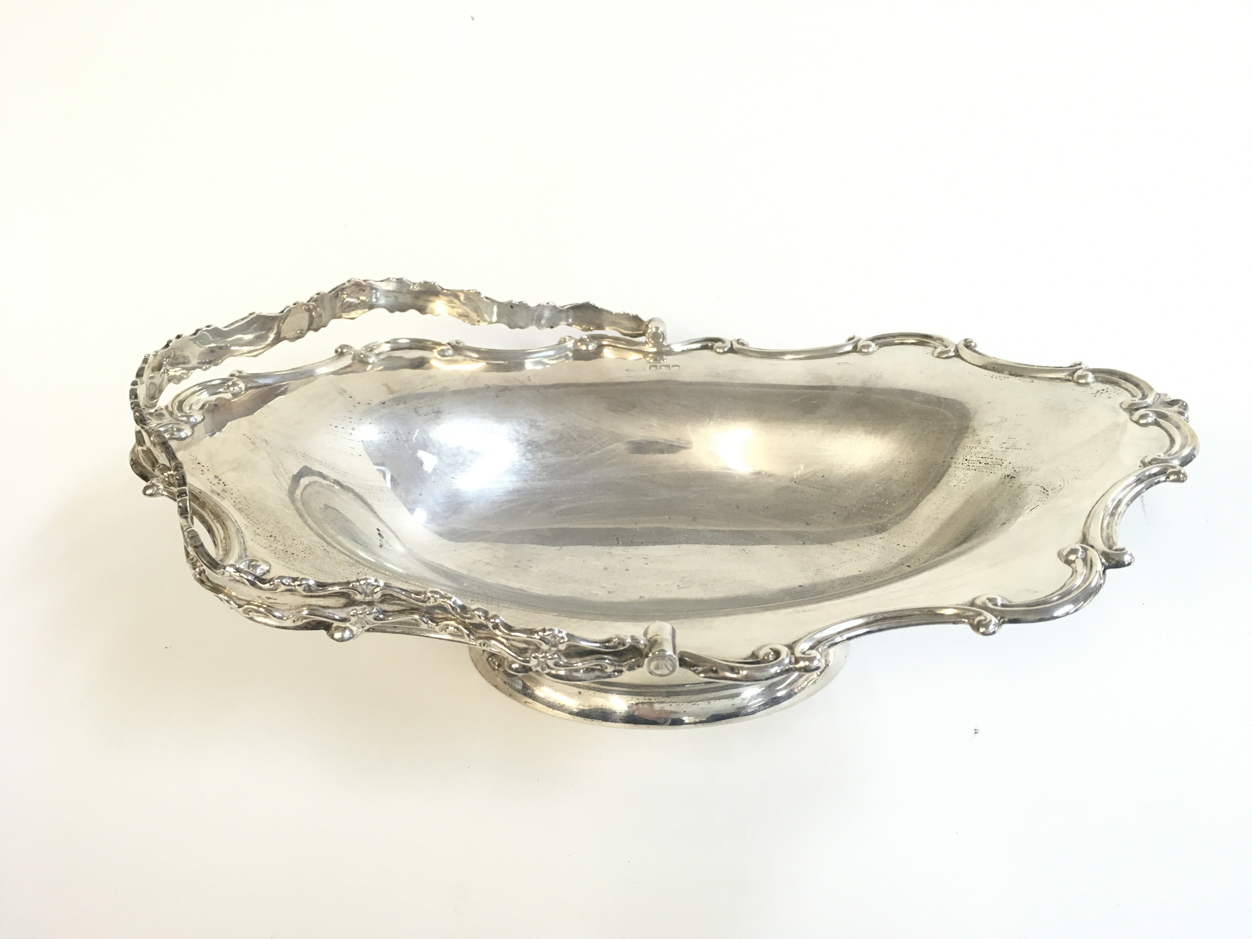 A silver hallmarked swing handle basket, 19cm wide. Sheffield 1919. Postage category B