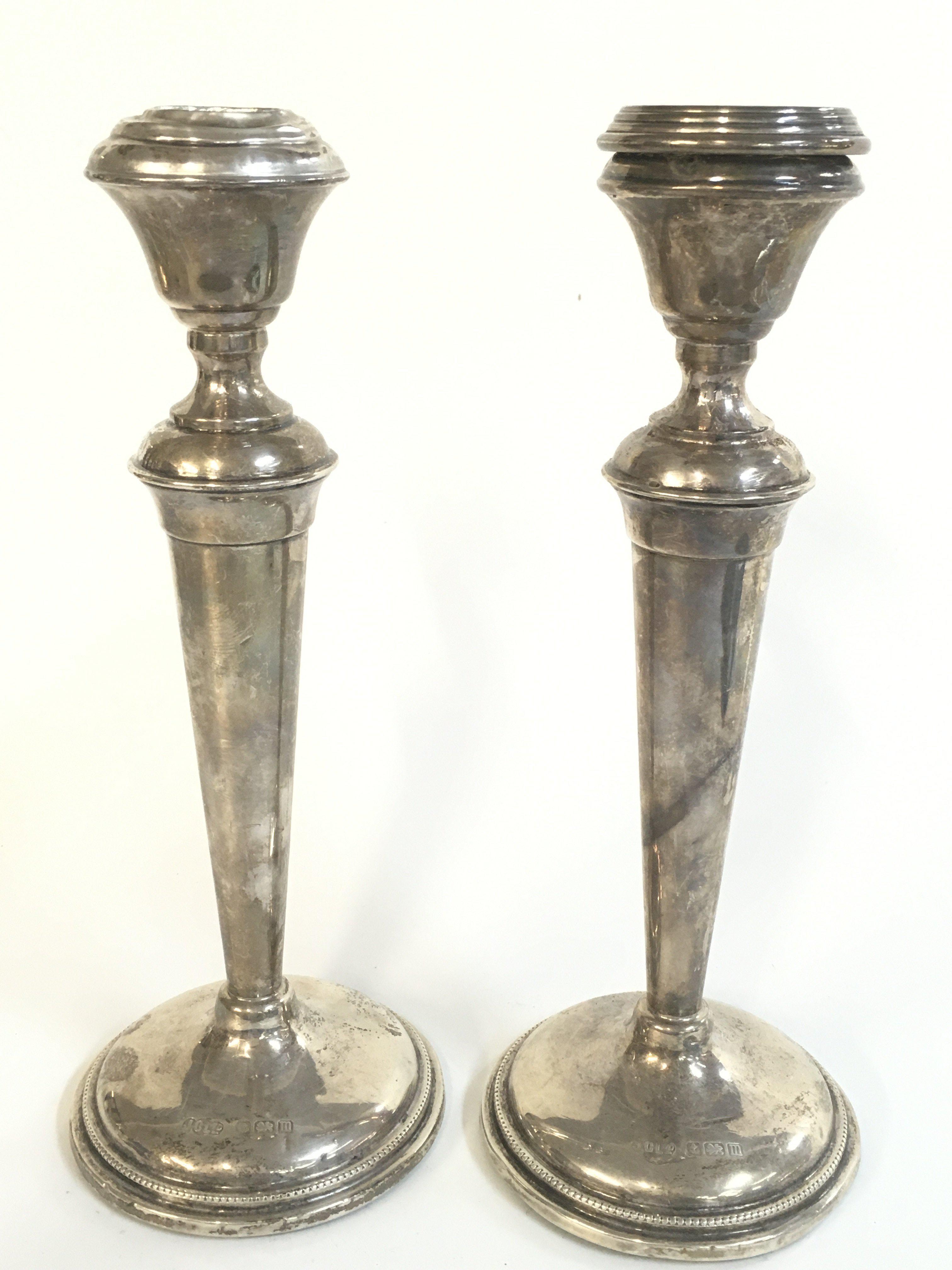 Silver hallmarked candle sticks, 21cm tall. Postage category B